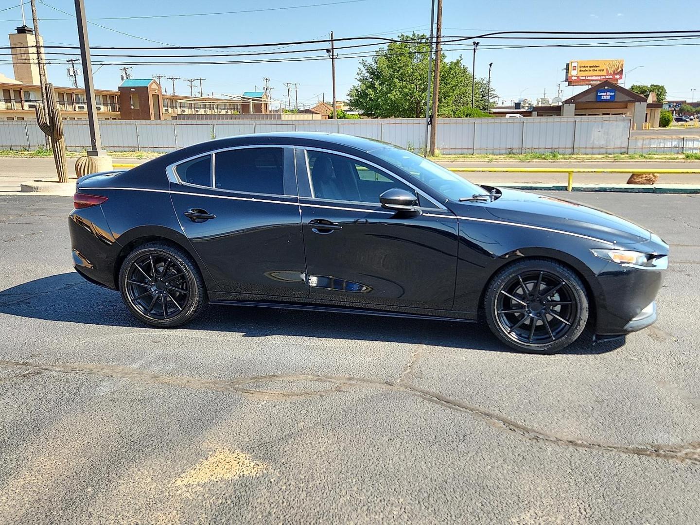 2020 Jet Black Mica Mazda Mazda3 Sedan Select Package (3MZBPBCM8LM) with an SKYACTIV-G 2.5L I-4 gasoline direct injection, DOHC, variable valve control, regular unleaded, engine with cylinder deactivation and 186HP engine, located at 4711 Ave Q, Lubbock, TX, 79412, (806) 687-2362, 33.551304, -101.855293 - Photo#4