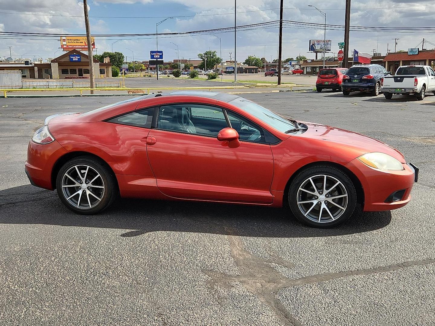 2011 Sunset Pearlescent Mitsubishi Eclipse GS (4A31K5DF6BE) with an 2.4L I-4 MIVEC variable valve control, regular unleaded, engine with 162HP engine, located at 4711 Ave Q, Lubbock, TX, 79412, (806) 687-2362, 33.551304, -101.855293 - Photo#4