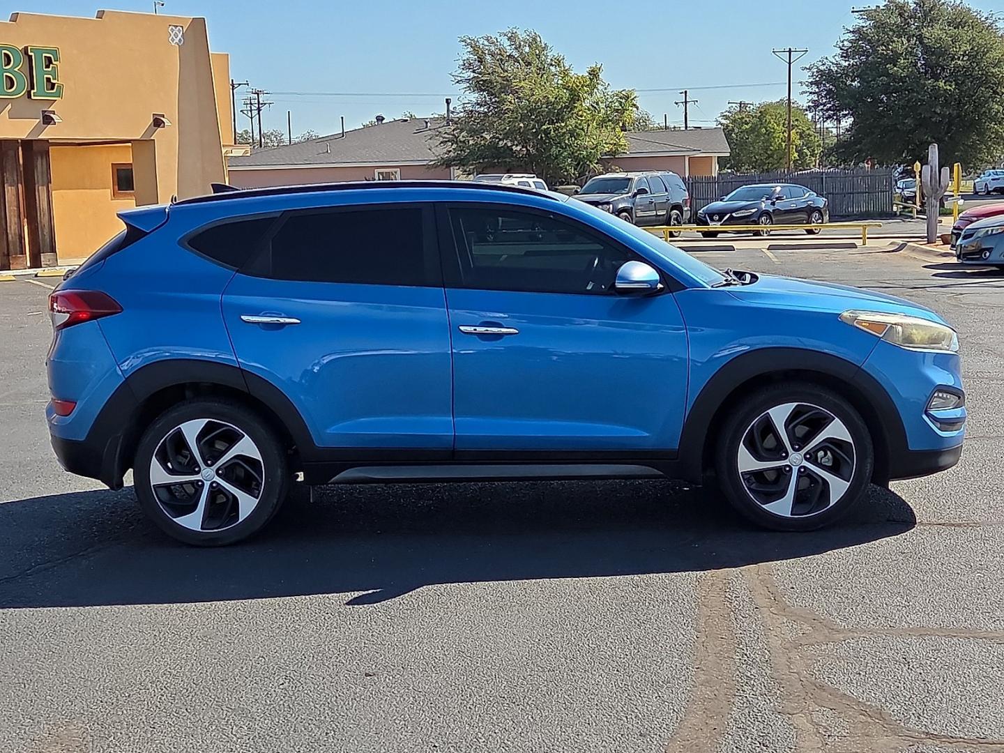 2016 Caribbean Blue - R5U /Black - TRY Hyundai Tucson Limited (KM8J33A21GU) with an 1.6L I-4 direct injection, DOHC, variable valve control, intercooled turbo, regular gasoline, engine with 175HP engine, located at 4711 Ave Q, Lubbock, TX, 79412, (806) 687-2362, 33.551304, -101.855293- Photo#5