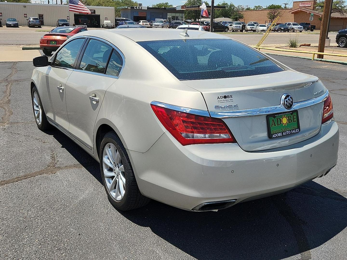 2014 GOLD Buick LaCrosse Leather Group (1G4GB5G37EF) with an 3.6L V-6 gasoline direct injection, DOHC, variable valve control, regular unleaded, engine with 304HP engine, located at 4711 Ave Q, Lubbock, TX, 79412, (806) 687-2362, 33.551304, -101.855293 - Photo#2