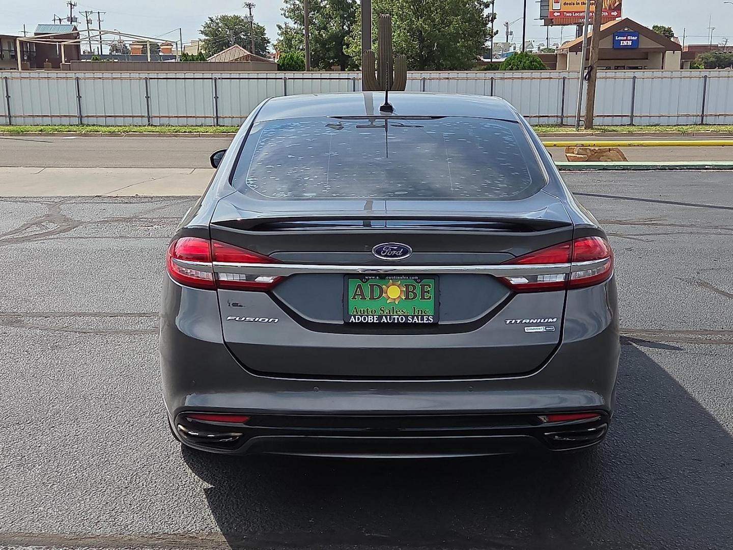 2018 Magnetic Metallic - J7 /Medium Soft Ceramic - CM Ford Fusion Titanium (3FA6P0D98JR) with an EcoBoost 2L I-4 gasoline direct injection, DOHC, variable valve control, intercooled turbo, regular unleaded, engine with 231HP engine, located at 4711 Ave Q, Lubbock, TX, 79412, (806) 687-2362, 33.551304, -101.855293 - Photo#3