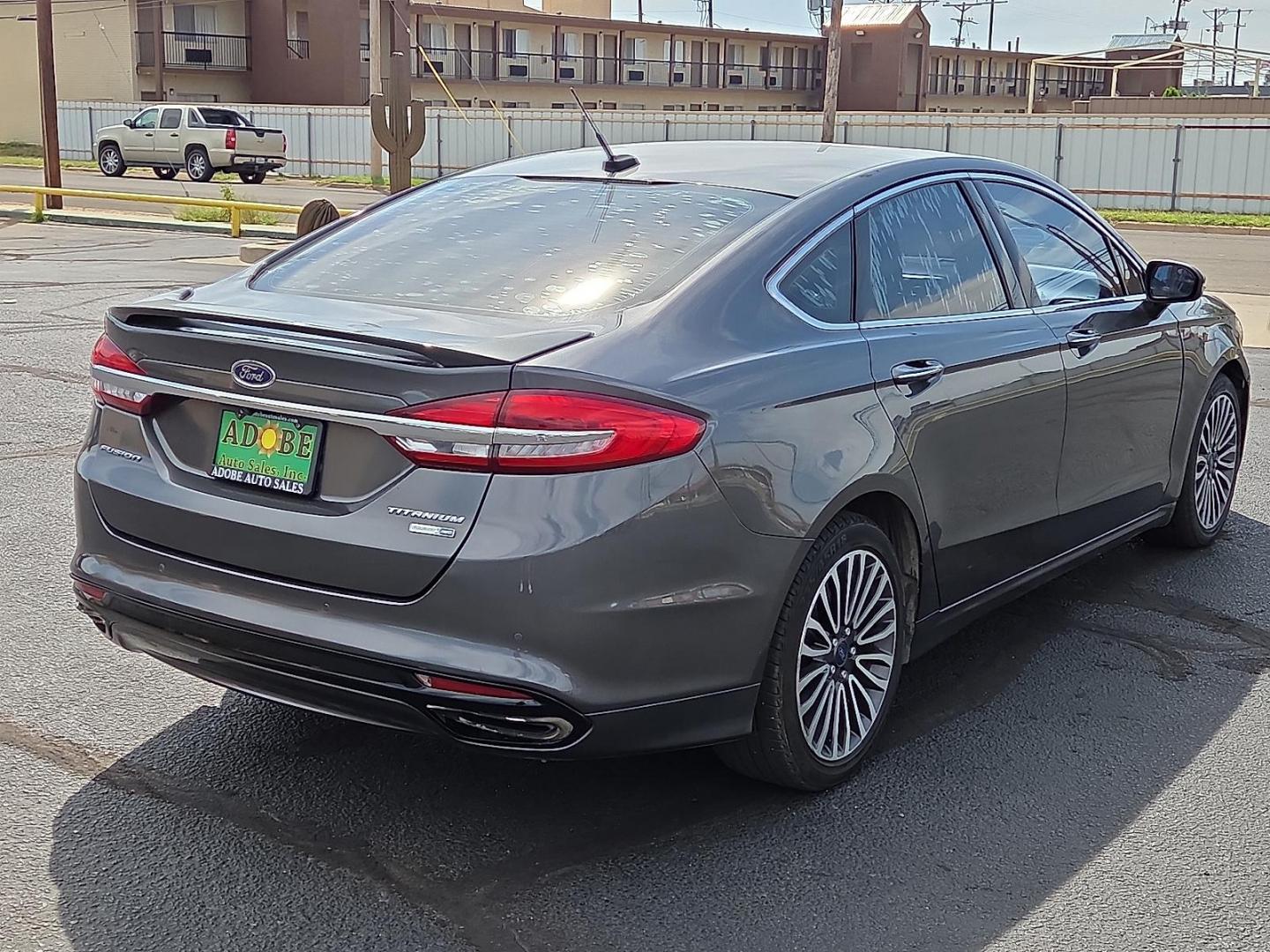 2018 Magnetic Metallic - J7 /Medium Soft Ceramic - CM Ford Fusion Titanium (3FA6P0D98JR) with an EcoBoost 2L I-4 gasoline direct injection, DOHC, variable valve control, intercooled turbo, regular unleaded, engine with 231HP engine, located at 4711 Ave Q, Lubbock, TX, 79412, (806) 687-2362, 33.551304, -101.855293 - Photo#4