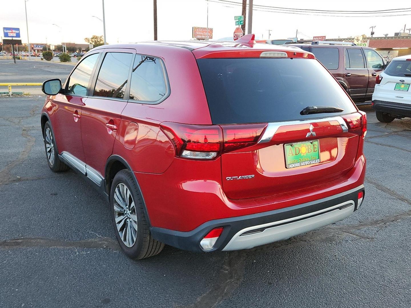 2020 RED Mitsubishi Outlander ES 2.4 (JA4AD2A31LZ) with an 2.4L I-4 MIVEC variable valve control, regular unleaded, engine with 166HP engine, located at 4711 Ave Q, Lubbock, TX, 79412, (806) 687-2362, 33.551304, -101.855293 - Photo#2