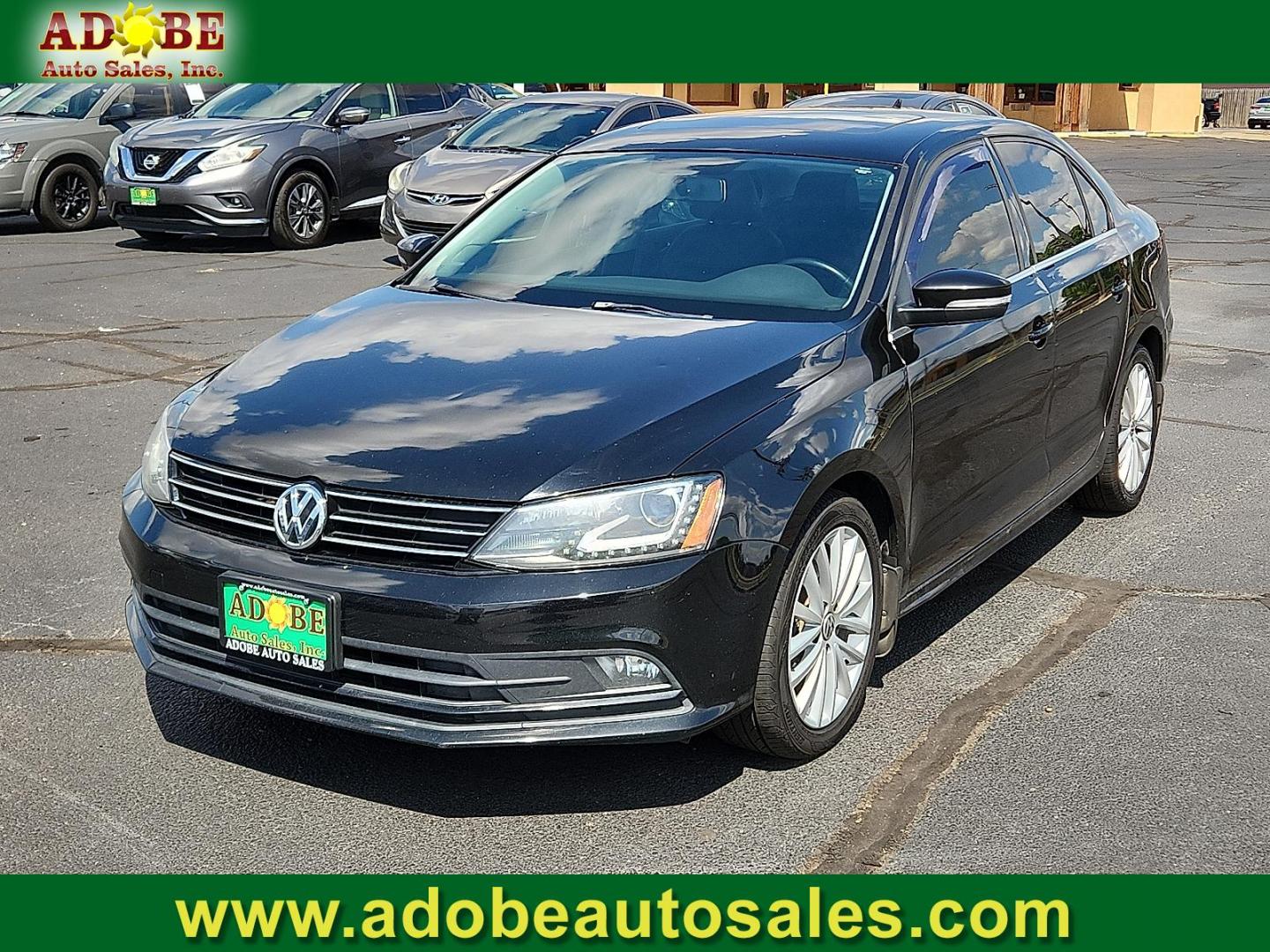 2015 BLACK Volkswagen Jetta 1.8T SE (3VWD17AJ1FM) with an 1.8L I-4 gasoline direct injection, DOHC, variable valve control, intercooled turbo, regular unleaded, engine with 170HP engine, located at 4711 Ave Q, Lubbock, TX, 79412, (806) 687-2362, 33.551304, -101.855293 - Photo#0