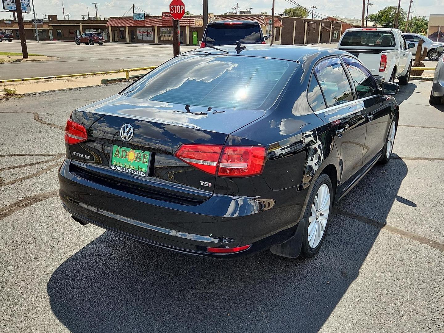 2015 BLACK Volkswagen Jetta 1.8T SE (3VWD17AJ1FM) with an 1.8L I-4 gasoline direct injection, DOHC, variable valve control, intercooled turbo, regular unleaded, engine with 170HP engine, located at 4711 Ave Q, Lubbock, TX, 79412, (806) 687-2362, 33.551304, -101.855293 - Photo#3