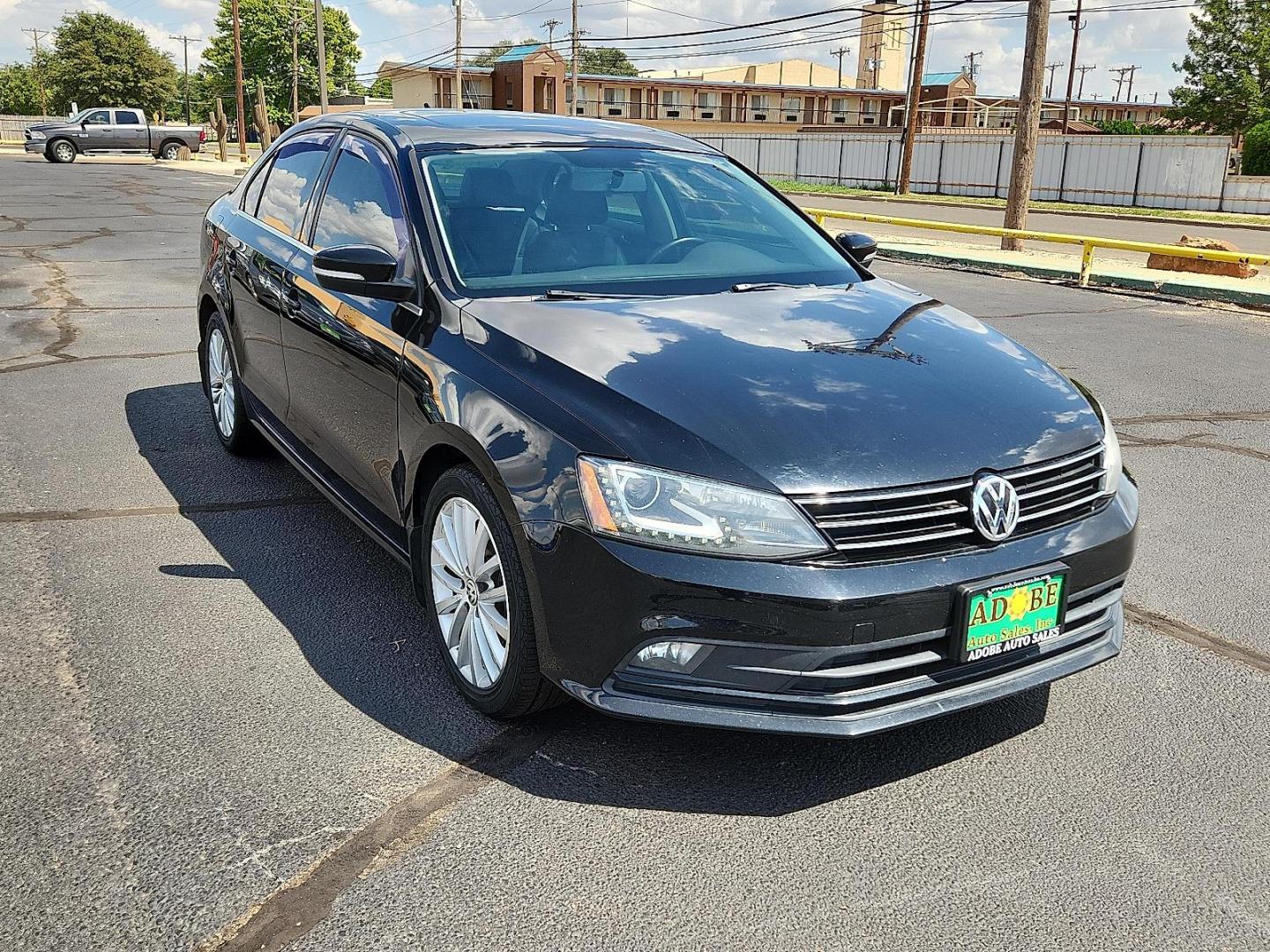 2015 BLACK Volkswagen Jetta 1.8T SE (3VWD17AJ1FM) with an 1.8L I-4 gasoline direct injection, DOHC, variable valve control, intercooled turbo, regular unleaded, engine with 170HP engine, located at 4711 Ave Q, Lubbock, TX, 79412, (806) 687-2362, 33.551304, -101.855293 - Photo#5