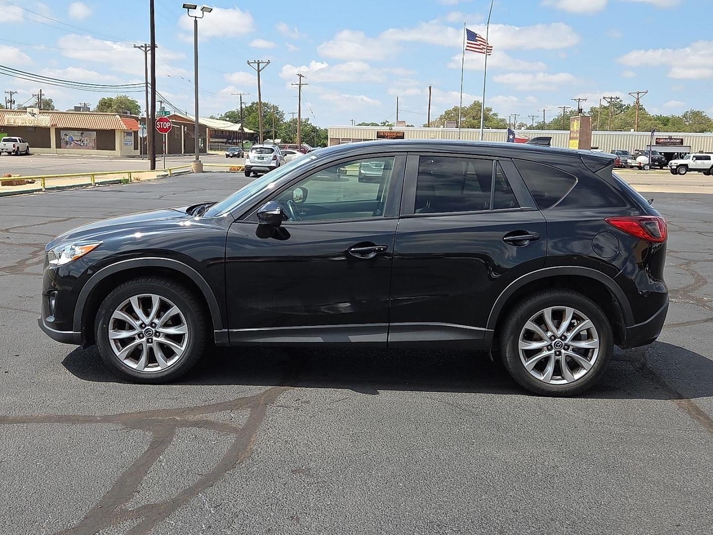2015 Deep Crystal Blue Mica - 42M /Sand - KC4 Mazda CX-5 Grand Touring (JM3KE2DY2F0) with an SKYACTIV-G 2.5L I-4 gasoline direct injection, DOHC, variable valve control, regular unleaded, engine with 184HP engine, located at 4711 Ave Q, Lubbock, TX, 79412, (806) 687-2362, 33.551304, -101.855293 - Photo#1