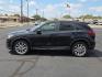 2015 Deep Crystal Blue Mica - 42M /Sand - KC4 Mazda CX-5 Grand Touring (JM3KE2DY2F0) with an SKYACTIV-G 2.5L I-4 gasoline direct injection, DOHC, variable valve control, regular unleaded, engine with 184HP engine, located at 4711 Ave Q, Lubbock, TX, 79412, (806) 687-2362, 33.551304, -101.855293 - Photo#1
