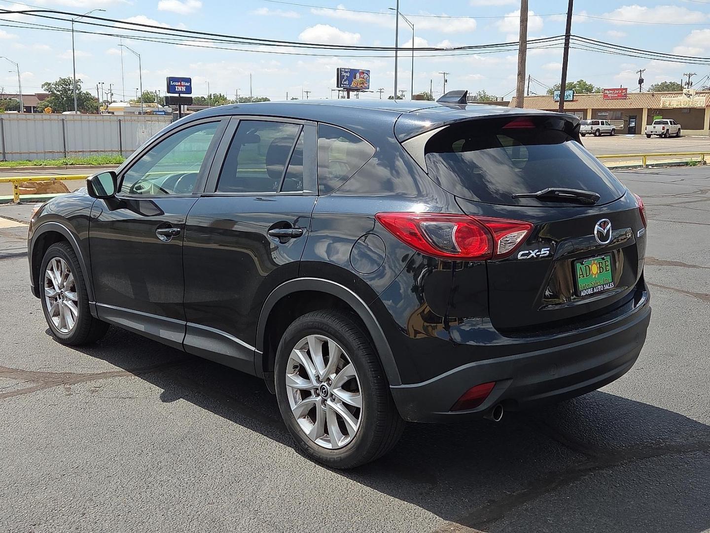 2015 Deep Crystal Blue Mica - 42M /Sand - KC4 Mazda CX-5 Grand Touring (JM3KE2DY2F0) with an SKYACTIV-G 2.5L I-4 gasoline direct injection, DOHC, variable valve control, regular unleaded, engine with 184HP engine, located at 4711 Ave Q, Lubbock, TX, 79412, (806) 687-2362, 33.551304, -101.855293 - Photo#2