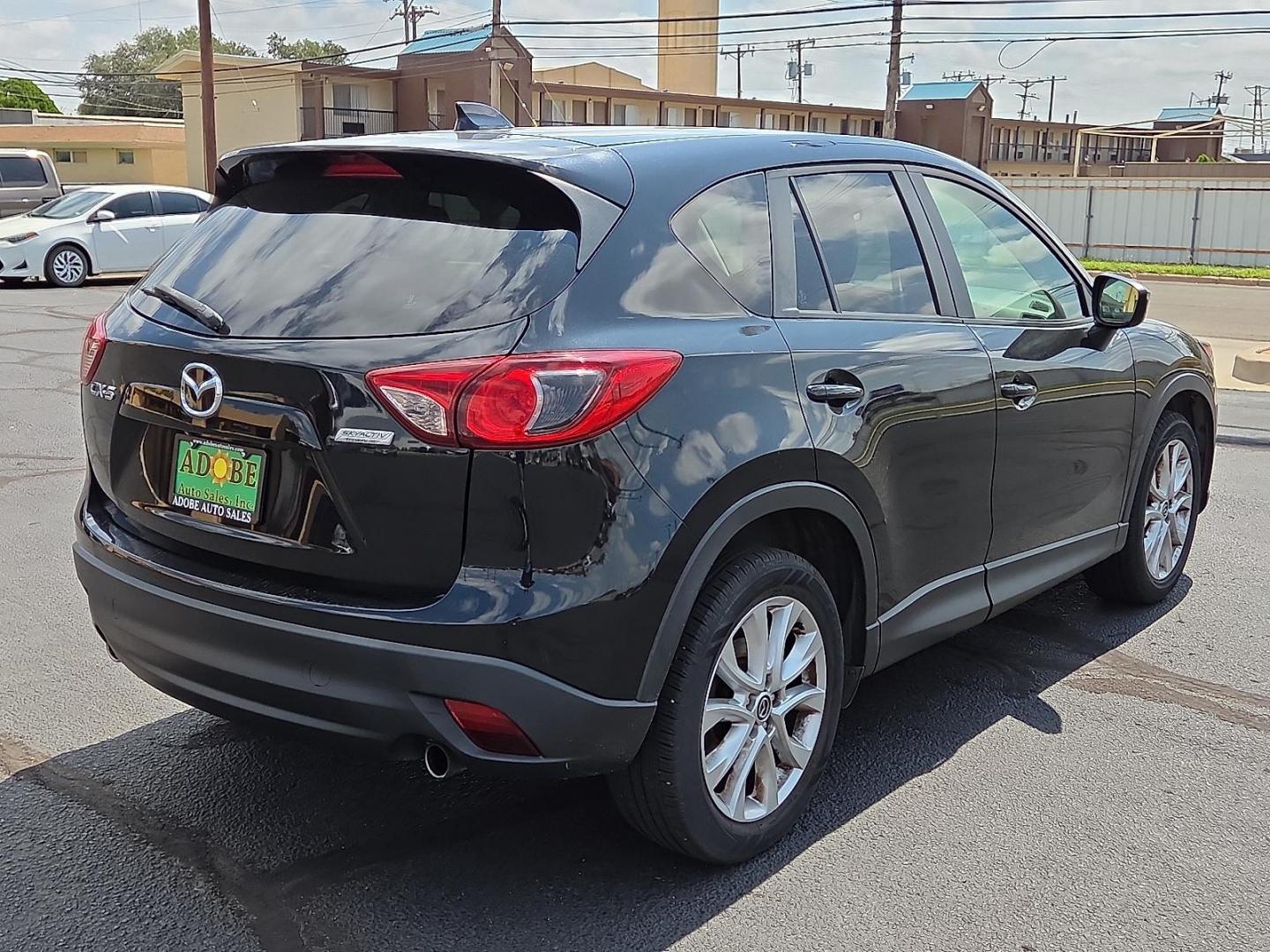 2015 Deep Crystal Blue Mica - 42M /Sand - KC4 Mazda CX-5 Grand Touring (JM3KE2DY2F0) with an SKYACTIV-G 2.5L I-4 gasoline direct injection, DOHC, variable valve control, regular unleaded, engine with 184HP engine, located at 4711 Ave Q, Lubbock, TX, 79412, (806) 687-2362, 33.551304, -101.855293 - Photo#4