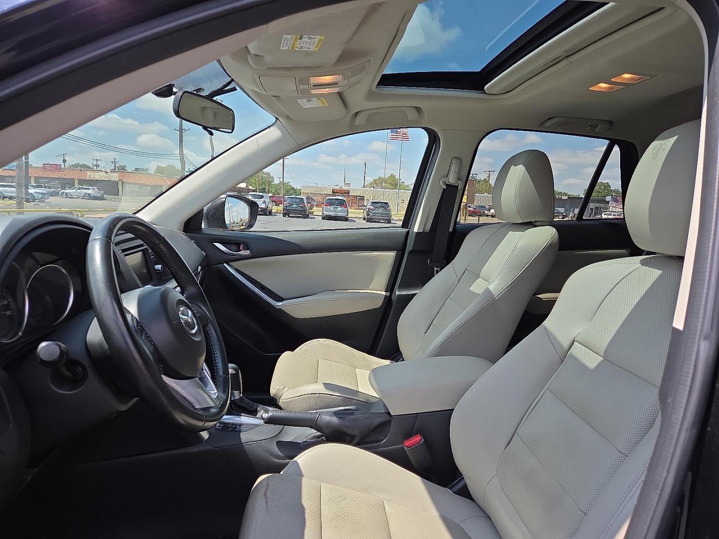 2015 Deep Crystal Blue Mica - 42M /Sand - KC4 Mazda CX-5 Grand Touring (JM3KE2DY2F0) with an SKYACTIV-G 2.5L I-4 gasoline direct injection, DOHC, variable valve control, regular unleaded, engine with 184HP engine, located at 4711 Ave Q, Lubbock, TX, 79412, (806) 687-2362, 33.551304, -101.855293 - Photo#22