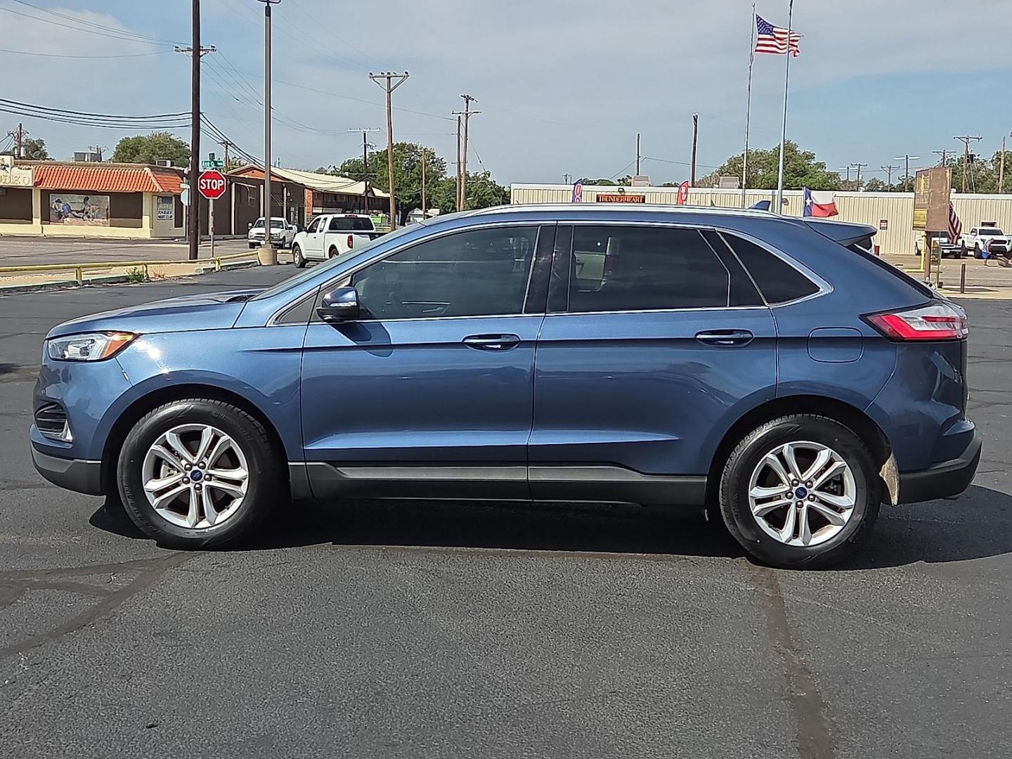 2019 Blue Metallic - FT /Dune - VD Ford Edge SEL (2FMPK3J91KB) with an EcoBoost 2L I-4 gasoline direct injection, DOHC, variable valve control, intercooled turbo, premium unleaded, engine with 250HP engine, located at 4711 Ave Q, Lubbock, TX, 79412, (806) 687-2362, 33.551304, -101.855293 - Photo#1