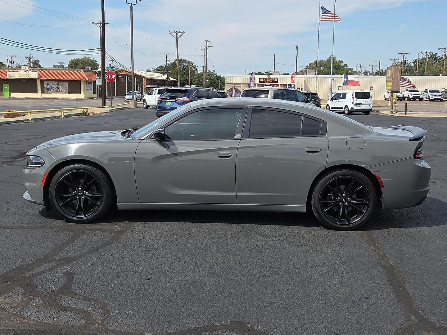 2018 Destroyer Gray Clearcoat - PDN /Black - X9 Dodge Charger SXT RWD (2C3CDXBG3JH) with an Pentastar 3.6L V-6 DOHC, variable valve control, regular unleaded, engine with 292HP engine, located at 4711 Ave Q, Lubbock, TX, 79412, (806) 687-2362, 33.551304, -101.855293 - Photo#1