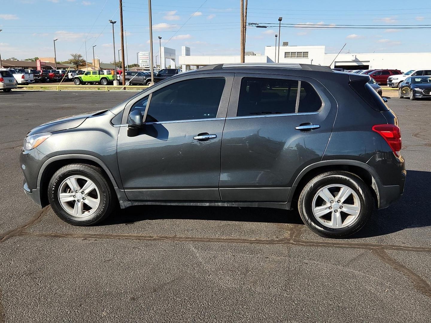 2019 GRAY Chevrolet Trax LT (3GNCJLSB7KL) with an Ecotec 1.4L I-4 DOHC, variable valve control, intercooled turbo, regular unleaded, engine with 138HP engine, located at 4711 Ave Q, Lubbock, TX, 79412, (806) 687-2362, 33.551304, -101.855293 - Photo#1