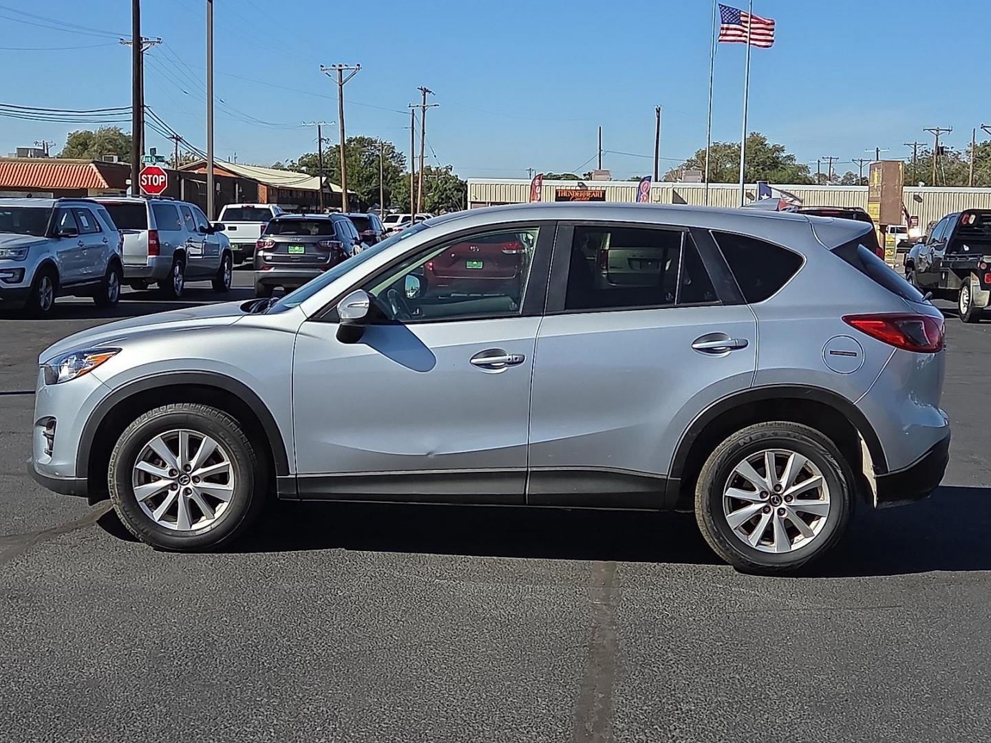 2016 Sonic Silver Metallic - 45P /Black - KC3 Mazda CX-5 Touring (JM3KE2CY3G0) with an SKYACTIV-G 2.5L I-4 gasoline direct injection, DOHC, variable valve control, regular unleaded, engine with 184HP engine, located at 4711 Ave Q, Lubbock, TX, 79412, (806) 687-2362, 33.551304, -101.855293 - Photo#1
