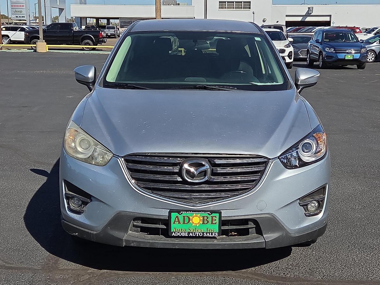 2016 Sonic Silver Metallic - 45P /Black - KC3 Mazda CX-5 Touring (JM3KE2CY3G0) with an SKYACTIV-G 2.5L I-4 gasoline direct injection, DOHC, variable valve control, regular unleaded, engine with 184HP engine, located at 4711 Ave Q, Lubbock, TX, 79412, (806) 687-2362, 33.551304, -101.855293 - Photo#7