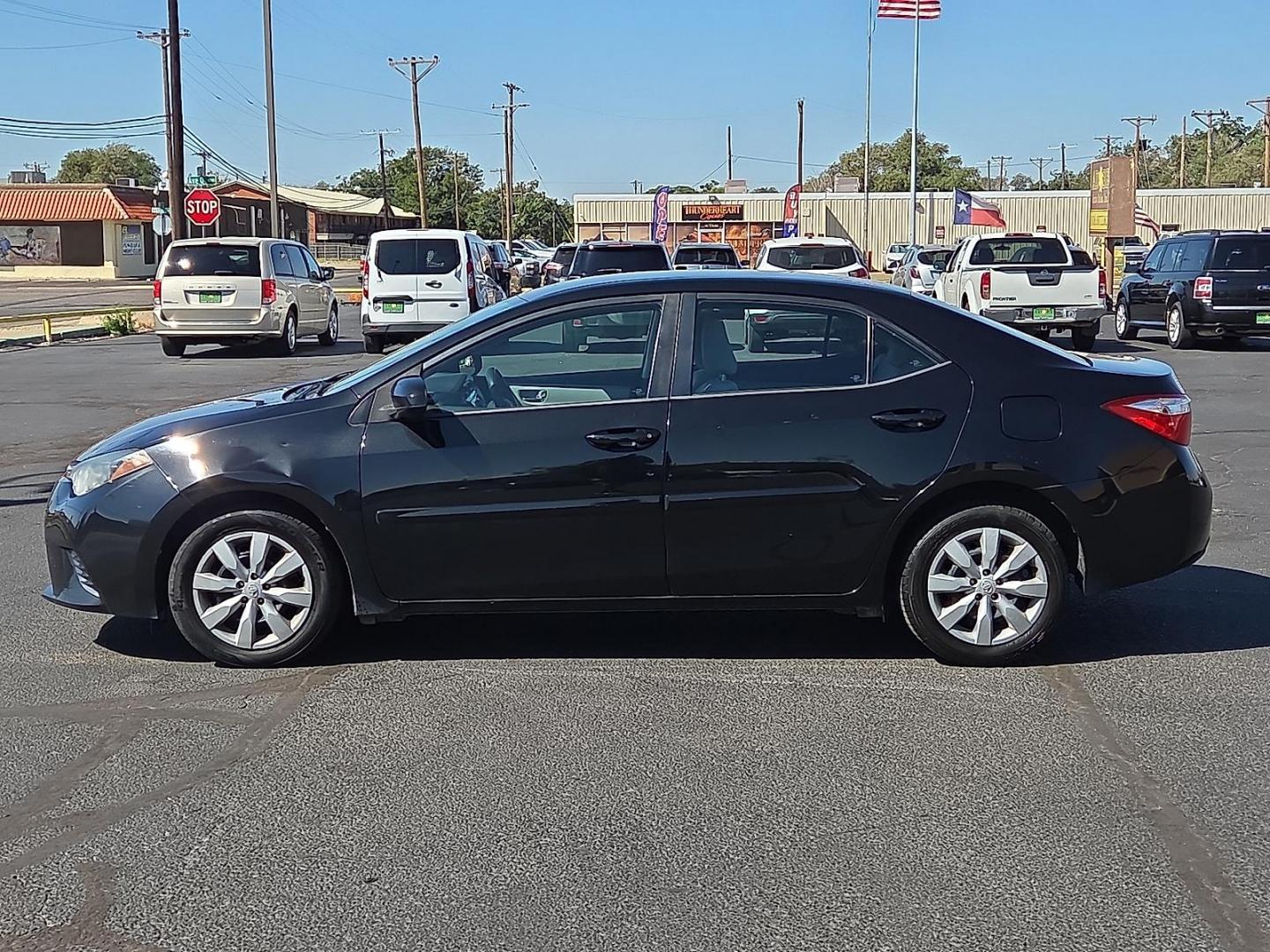 2015 Black Sand Mica - 209 /Ash - 16 Toyota Corolla LE (2T1BURHE7FC) with an 1.8L I-4 DOHC, VVT-i variable valve control, regular unleaded, engine with 132HP engine, located at 4711 Ave Q, Lubbock, TX, 79412, (806) 687-2362, 33.551304, -101.855293 - Photo#1