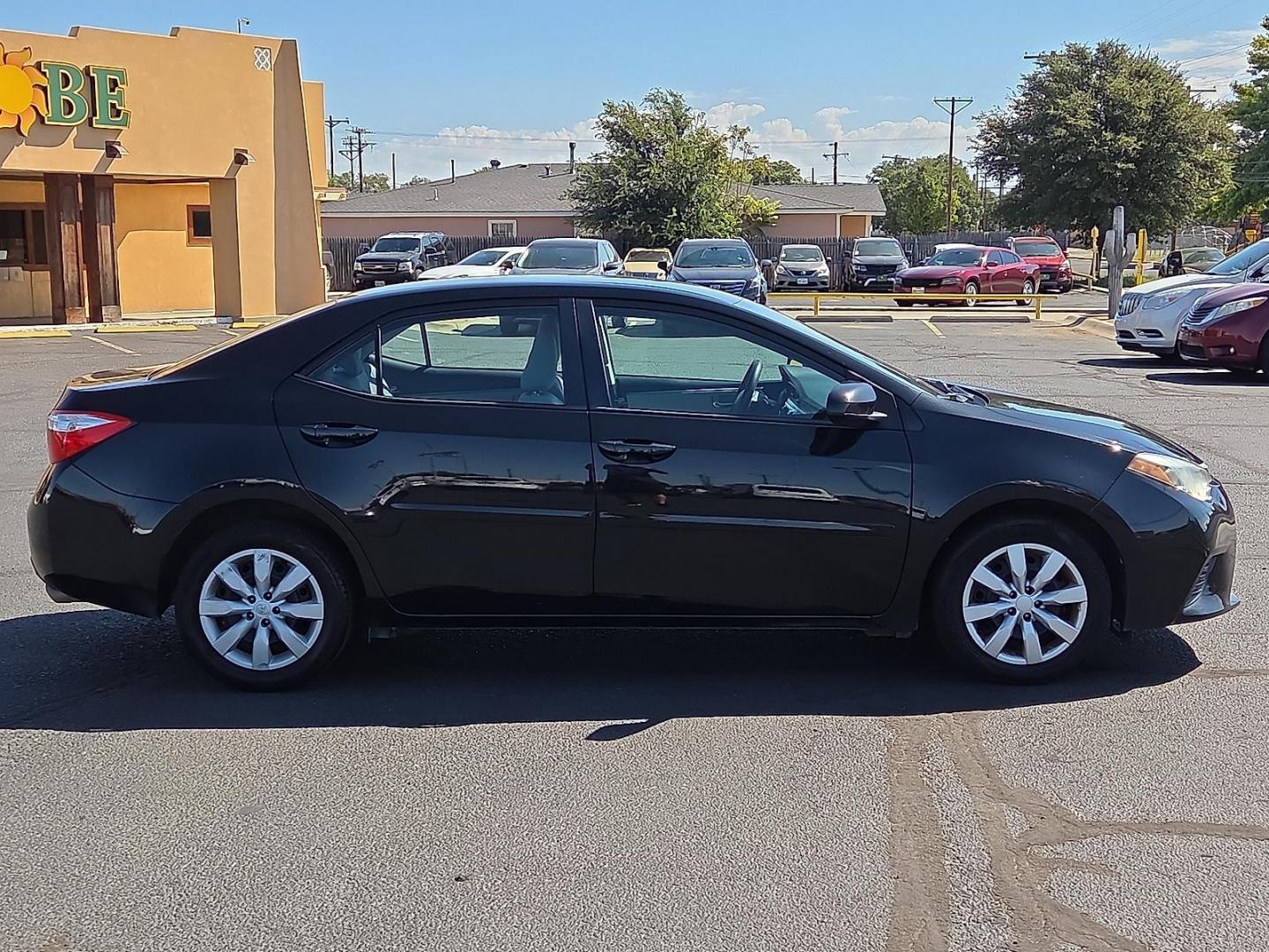 2015 Black Sand Mica - 209 /Ash - 16 Toyota Corolla LE (2T1BURHE7FC) with an 1.8L I-4 DOHC, VVT-i variable valve control, regular unleaded, engine with 132HP engine, located at 4711 Ave Q, Lubbock, TX, 79412, (806) 687-2362, 33.551304, -101.855293 - Photo#5