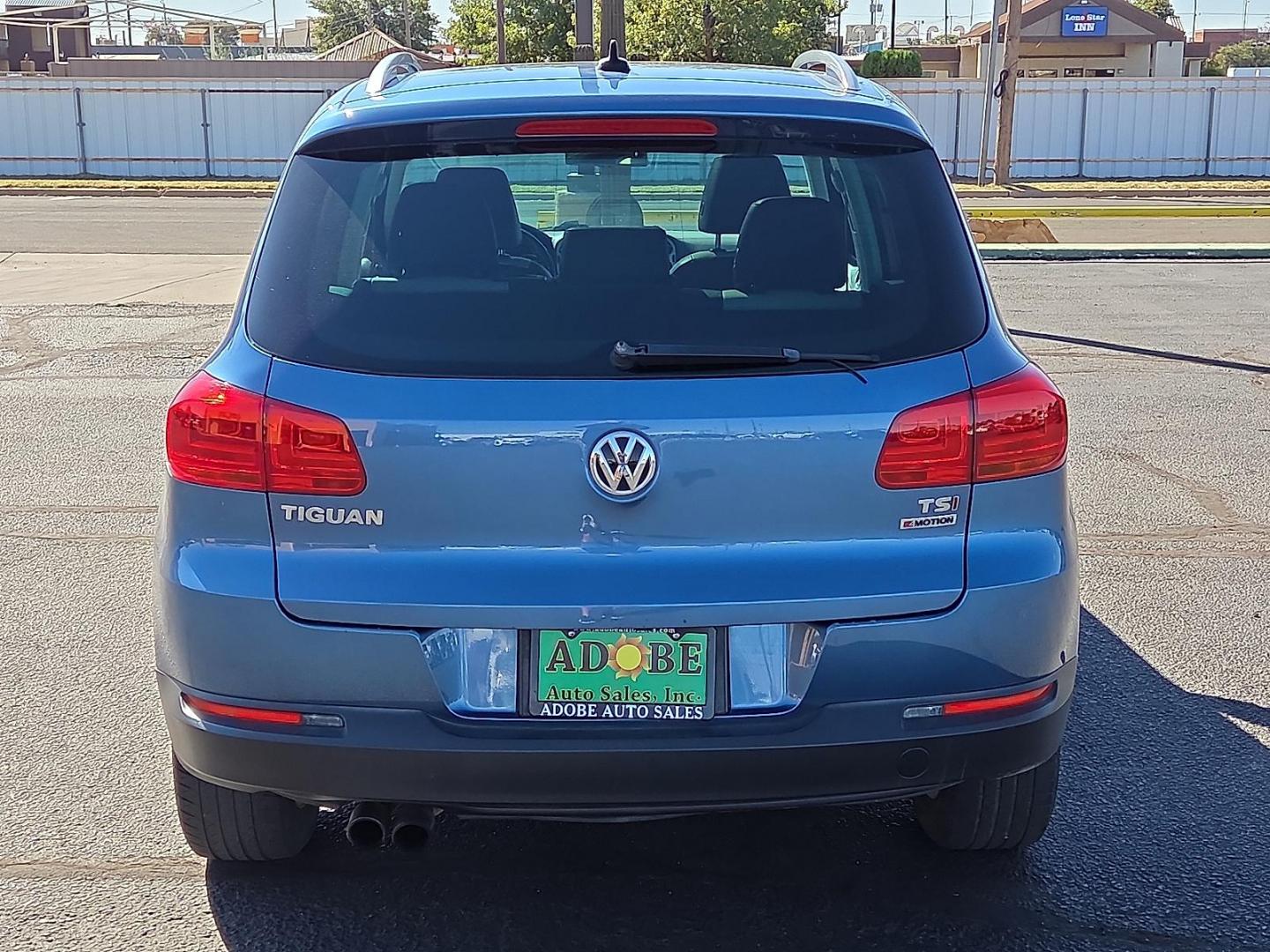 2017 Pacific Blue Metallic - D5D5 /Cornsilk Beige - NT Volkswagen Tiguan 2.0T Wolfsburg Edition (WVGSV7AX8HK) with an 2L I-4 gasoline direct injection, DOHC, variable valve control, intercooled turbo, premium unleaded, engine with 200HP engine, located at 4711 Ave Q, Lubbock, TX, 79412, (806) 687-2362, 33.551304, -101.855293 - Photo#3