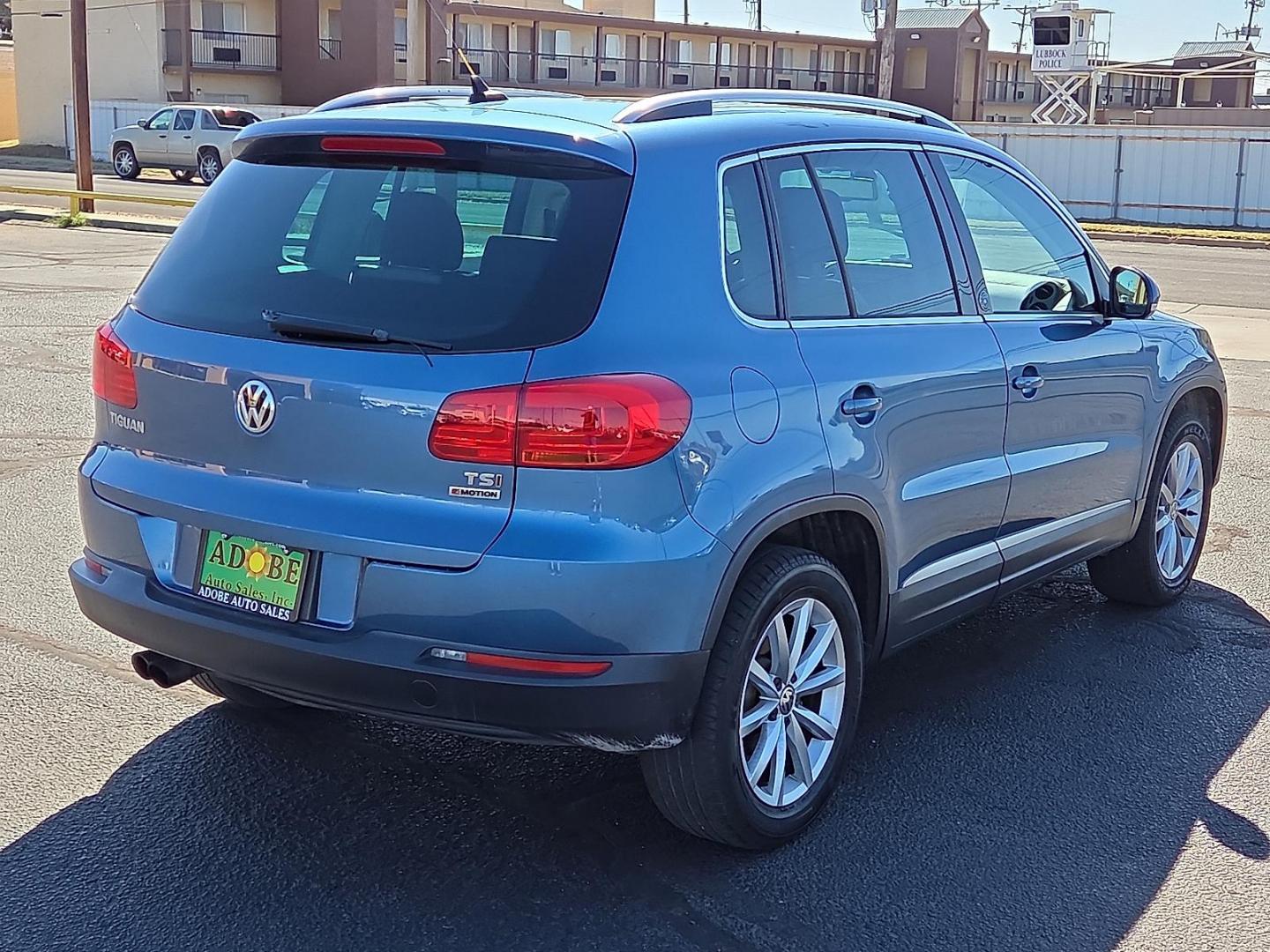 2017 Pacific Blue Metallic - D5D5 /Cornsilk Beige - NT Volkswagen Tiguan 2.0T Wolfsburg Edition (WVGSV7AX8HK) with an 2L I-4 gasoline direct injection, DOHC, variable valve control, intercooled turbo, premium unleaded, engine with 200HP engine, located at 4711 Ave Q, Lubbock, TX, 79412, (806) 687-2362, 33.551304, -101.855293 - Photo#4