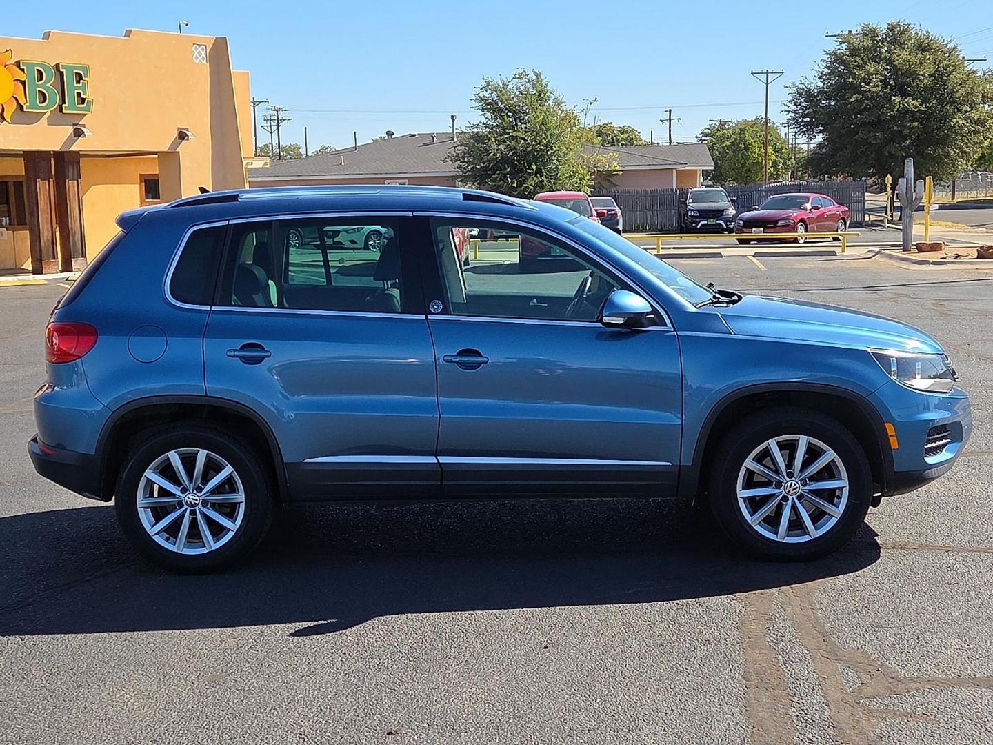 2017 Pacific Blue Metallic - D5D5 /Cornsilk Beige - NT Volkswagen Tiguan 2.0T Wolfsburg Edition (WVGSV7AX8HK) with an 2L I-4 gasoline direct injection, DOHC, variable valve control, intercooled turbo, premium unleaded, engine with 200HP engine, located at 4711 Ave Q, Lubbock, TX, 79412, (806) 687-2362, 33.551304, -101.855293 - Photo#5