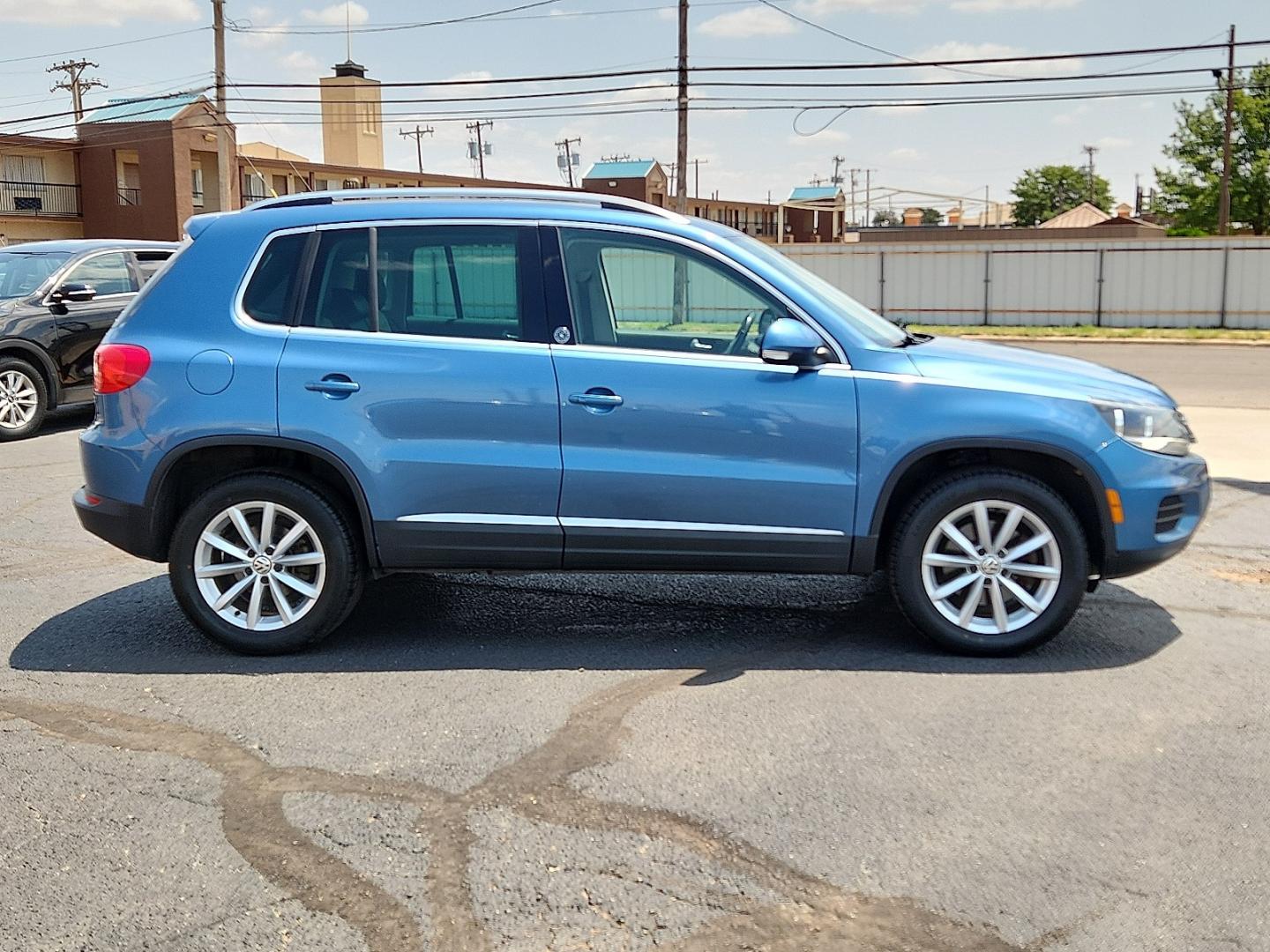 2017 BLUE /Cornsilk Beige - NT Volkswagen Tiguan 2.0T Wolfsburg Edition (WVGSV7AX8HK) with an 2L I-4 gasoline direct injection, DOHC, variable valve control, intercooled turbo, premium unleaded, engine with 200HP engine, located at 4711 Ave Q, Lubbock, TX, 79412, (806) 687-2362, 33.551304, -101.855293- Photo#4