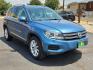 2017 BLUE /Cornsilk Beige - NT Volkswagen Tiguan 2.0T Wolfsburg Edition (WVGSV7AX8HK) with an 2L I-4 gasoline direct injection, DOHC, variable valve control, intercooled turbo, premium unleaded, engine with 200HP engine, located at 4711 Ave Q, Lubbock, TX, 79412, (806) 687-2362, 33.551304, -101.855293- Photo#5