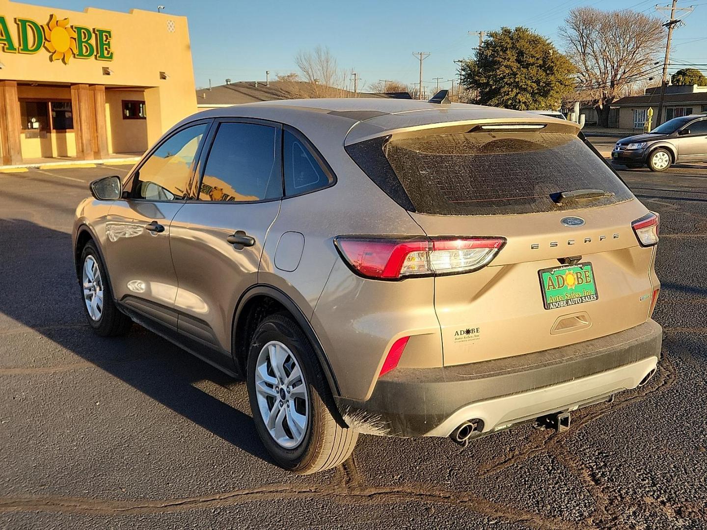 2020 GOLD Ford Escape S (1FMCU0F6XLU) with an EcoBoost 1.5L I-3 port/direct injection, DOHC, Ti-VCT variable valve control, intercooled turbo, premium unleaded, engine with 181HP engine, located at 4711 Ave Q, Lubbock, TX, 79412, (806) 687-2362, 33.551304, -101.855293 - Photo#2