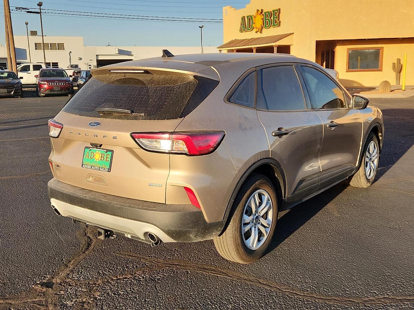 2020 GOLD Ford Escape S (1FMCU0F6XLU) with an EcoBoost 1.5L I-3 port/direct injection, DOHC, Ti-VCT variable valve control, intercooled turbo, premium unleaded, engine with 181HP engine, located at 4711 Ave Q, Lubbock, TX, 79412, (806) 687-2362, 33.551304, -101.855293 - Photo#3