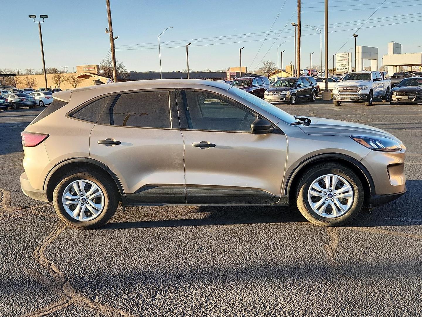 2020 GOLD Ford Escape S (1FMCU0F6XLU) with an EcoBoost 1.5L I-3 port/direct injection, DOHC, Ti-VCT variable valve control, intercooled turbo, premium unleaded, engine with 181HP engine, located at 4711 Ave Q, Lubbock, TX, 79412, (806) 687-2362, 33.551304, -101.855293 - Photo#4