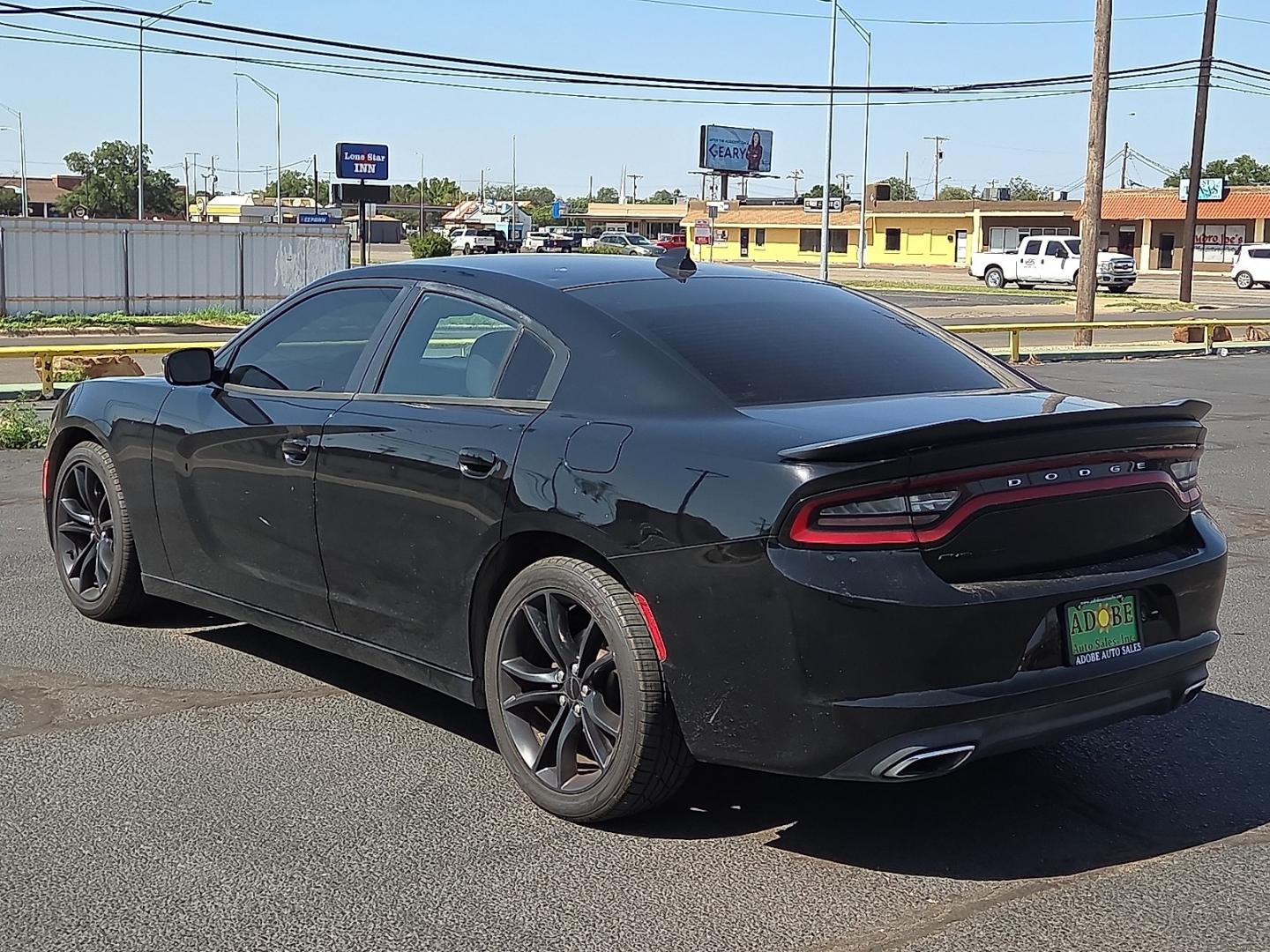 2016 Pitch Black Clearcoat - PX8 /Black - X9 Dodge Charger SXT (2C3CDXHG1GH) with an Pentastar 3.6L V-6 DOHC, variable valve control, regular unleaded, engine with 292HP engine, located at 4711 Ave Q, Lubbock, TX, 79412, (806) 687-2362, 33.551304, -101.855293- Photo#2