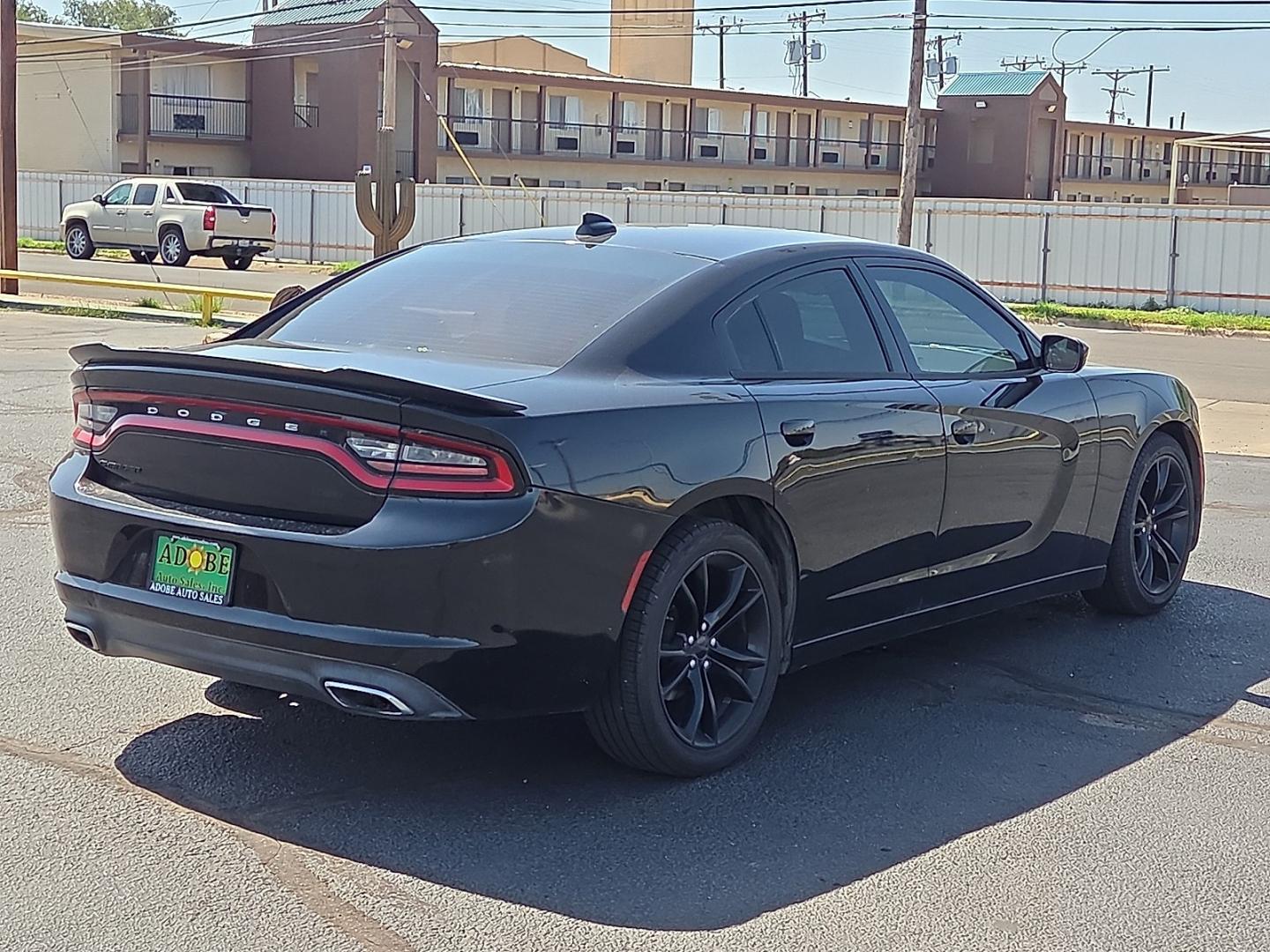 2016 Pitch Black Clearcoat - PX8 /Black - X9 Dodge Charger SXT (2C3CDXHG1GH) with an Pentastar 3.6L V-6 DOHC, variable valve control, regular unleaded, engine with 292HP engine, located at 4711 Ave Q, Lubbock, TX, 79412, (806) 687-2362, 33.551304, -101.855293- Photo#4