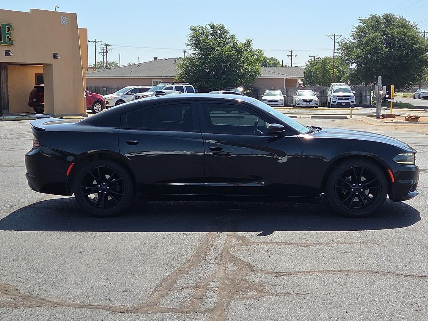 2016 Pitch Black Clearcoat - PX8 /Black - X9 Dodge Charger SXT (2C3CDXHG1GH) with an Pentastar 3.6L V-6 DOHC, variable valve control, regular unleaded, engine with 292HP engine, located at 4711 Ave Q, Lubbock, TX, 79412, (806) 687-2362, 33.551304, -101.855293- Photo#5