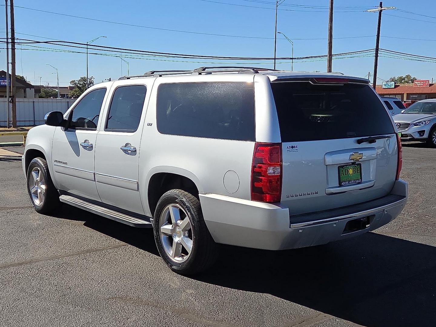 2014 Silver Ice Metallic - GAN /Ebony - 196 Chevrolet Suburban 1500 LTZ (1GNSCKE03ER) with an Vortec 5.3L V-8 variable valve control, regular unleaded, engine with cylinder deactivation and 320HP engine, located at 4711 Ave Q, Lubbock, TX, 79412, (806) 687-2362, 33.551304, -101.855293 - Photo#2