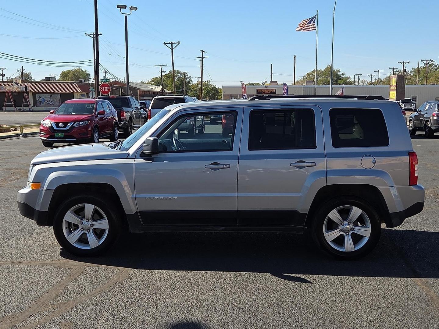 2017 Billet Silver Metallic Clearcoat - PSC /Dark Slate Gray - DV Jeep Patriot Latitude FWD (1C4NJPFA1HD) with an 2L I-4 DOHC, variable valve control, regular unleaded, engine with 158HP engine, located at 4711 Ave Q, Lubbock, TX, 79412, (806) 687-2362, 33.551304, -101.855293 - Photo#1