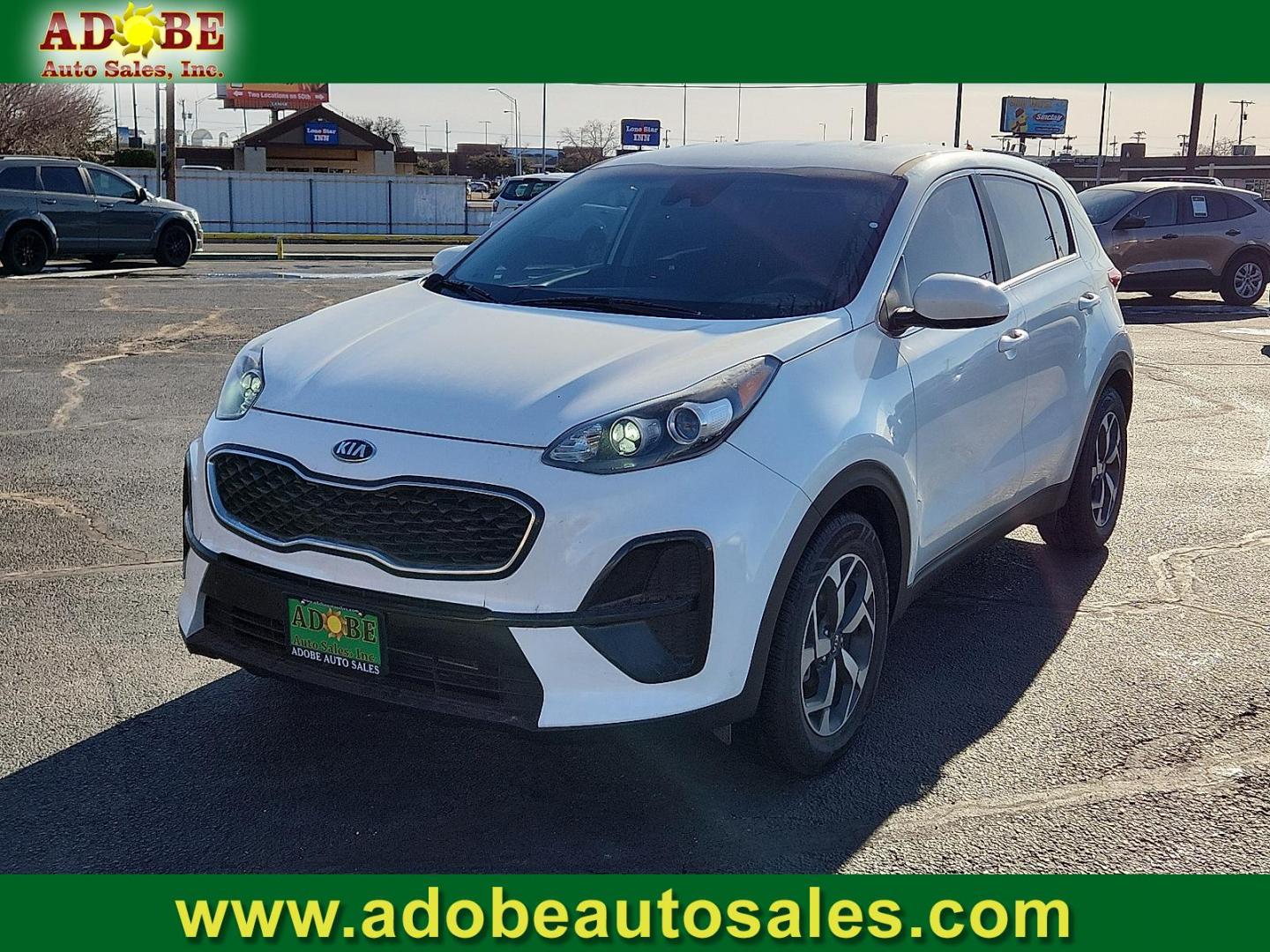 2021 WHITE Kia Sportage LX (KNDPM3AC5M7) with an Theta II 2.4L I-4 gasoline direct injection, DOHC, D-CVVT variable valve control, regular unleaded, engine with 181HP engine, located at 4711 Ave Q, Lubbock, TX, 79412, (806) 687-2362, 33.551304, -101.855293 - Photo#0