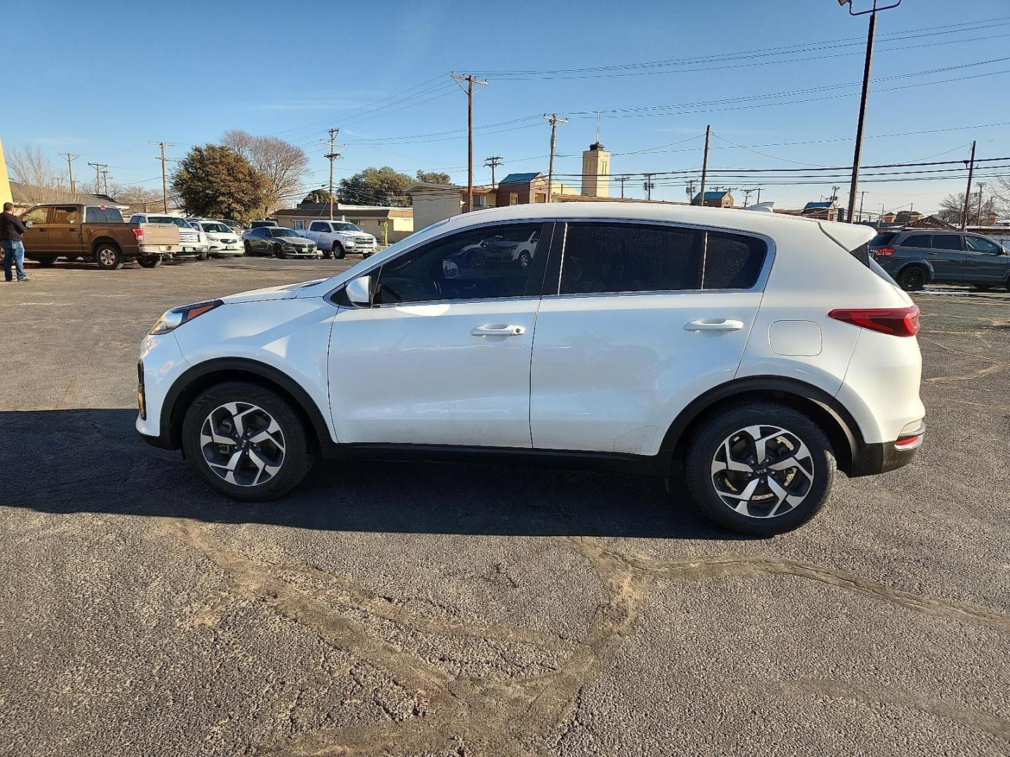 2021 WHITE Kia Sportage LX (KNDPM3AC5M7) with an Theta II 2.4L I-4 gasoline direct injection, DOHC, D-CVVT variable valve control, regular unleaded, engine with 181HP engine, located at 4711 Ave Q, Lubbock, TX, 79412, (806) 687-2362, 33.551304, -101.855293 - Photo#1