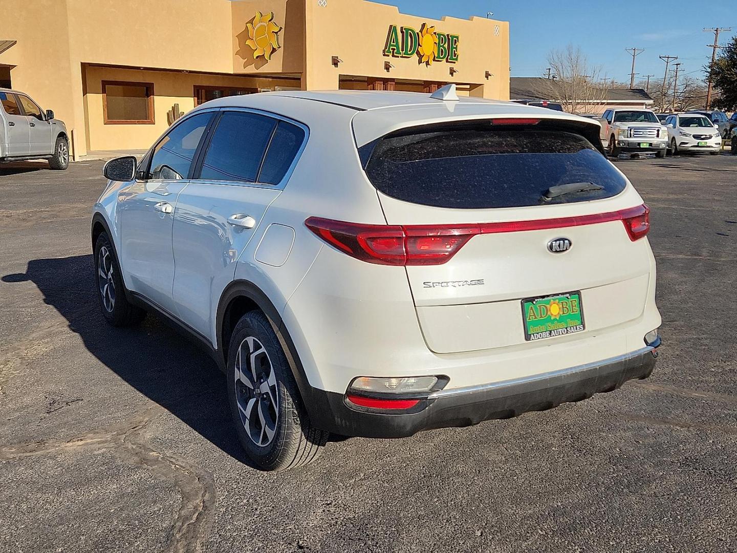 2021 WHITE Kia Sportage LX (KNDPM3AC5M7) with an Theta II 2.4L I-4 gasoline direct injection, DOHC, D-CVVT variable valve control, regular unleaded, engine with 181HP engine, located at 4711 Ave Q, Lubbock, TX, 79412, (806) 687-2362, 33.551304, -101.855293 - Photo#2