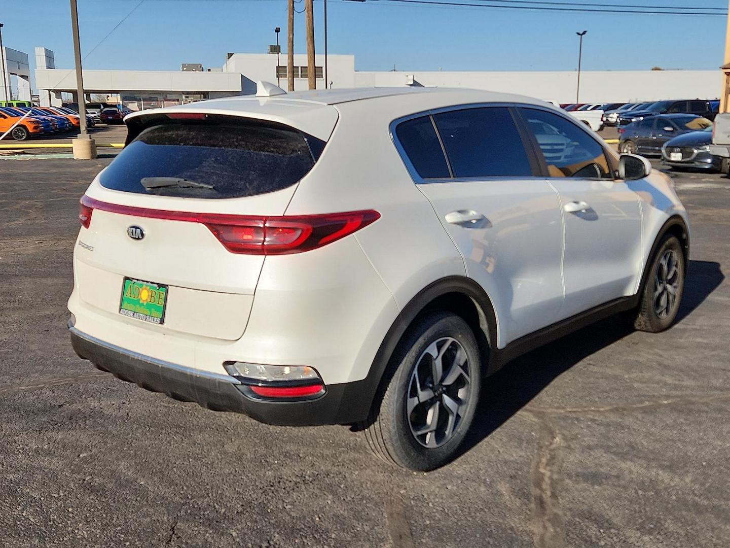 2021 WHITE Kia Sportage LX (KNDPM3AC5M7) with an Theta II 2.4L I-4 gasoline direct injection, DOHC, D-CVVT variable valve control, regular unleaded, engine with 181HP engine, located at 4711 Ave Q, Lubbock, TX, 79412, (806) 687-2362, 33.551304, -101.855293 - Photo#3