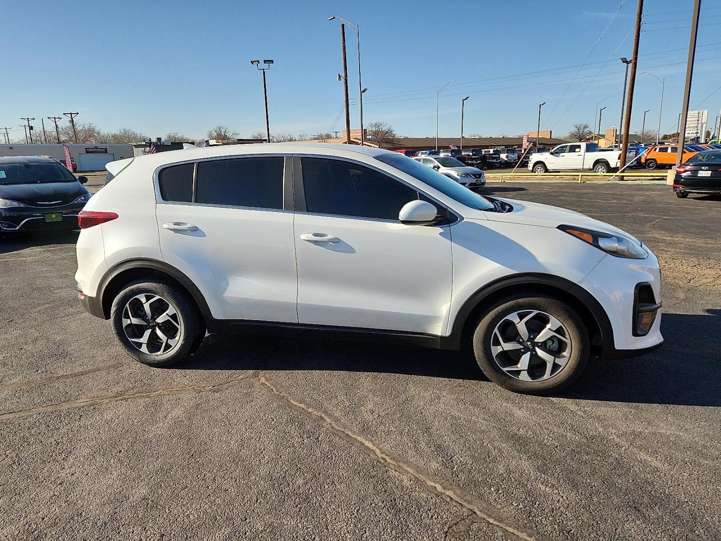 2021 WHITE Kia Sportage LX (KNDPM3AC5M7) with an Theta II 2.4L I-4 gasoline direct injection, DOHC, D-CVVT variable valve control, regular unleaded, engine with 181HP engine, located at 4711 Ave Q, Lubbock, TX, 79412, (806) 687-2362, 33.551304, -101.855293 - Photo#4