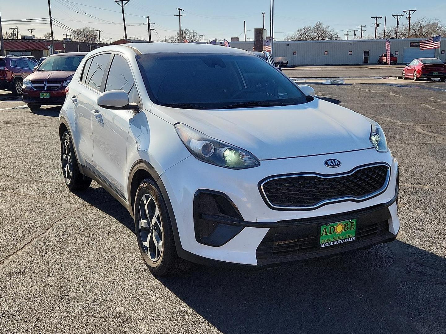 2021 WHITE Kia Sportage LX (KNDPM3AC5M7) with an Theta II 2.4L I-4 gasoline direct injection, DOHC, D-CVVT variable valve control, regular unleaded, engine with 181HP engine, located at 4711 Ave Q, Lubbock, TX, 79412, (806) 687-2362, 33.551304, -101.855293 - Photo#5