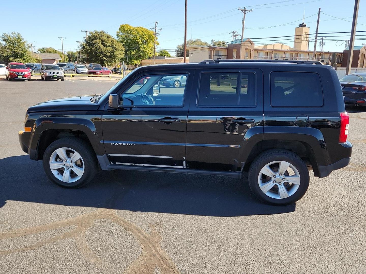 2012 BLACK Jeep Patriot Latitude (1C4NJPFB6CD) with an 2.4L I-4 DOHC, variable valve control, regular unleaded, engine with 172HP engine, located at 4711 Ave Q, Lubbock, TX, 79412, (806) 687-2362, 33.551304, -101.855293 - Photo#1