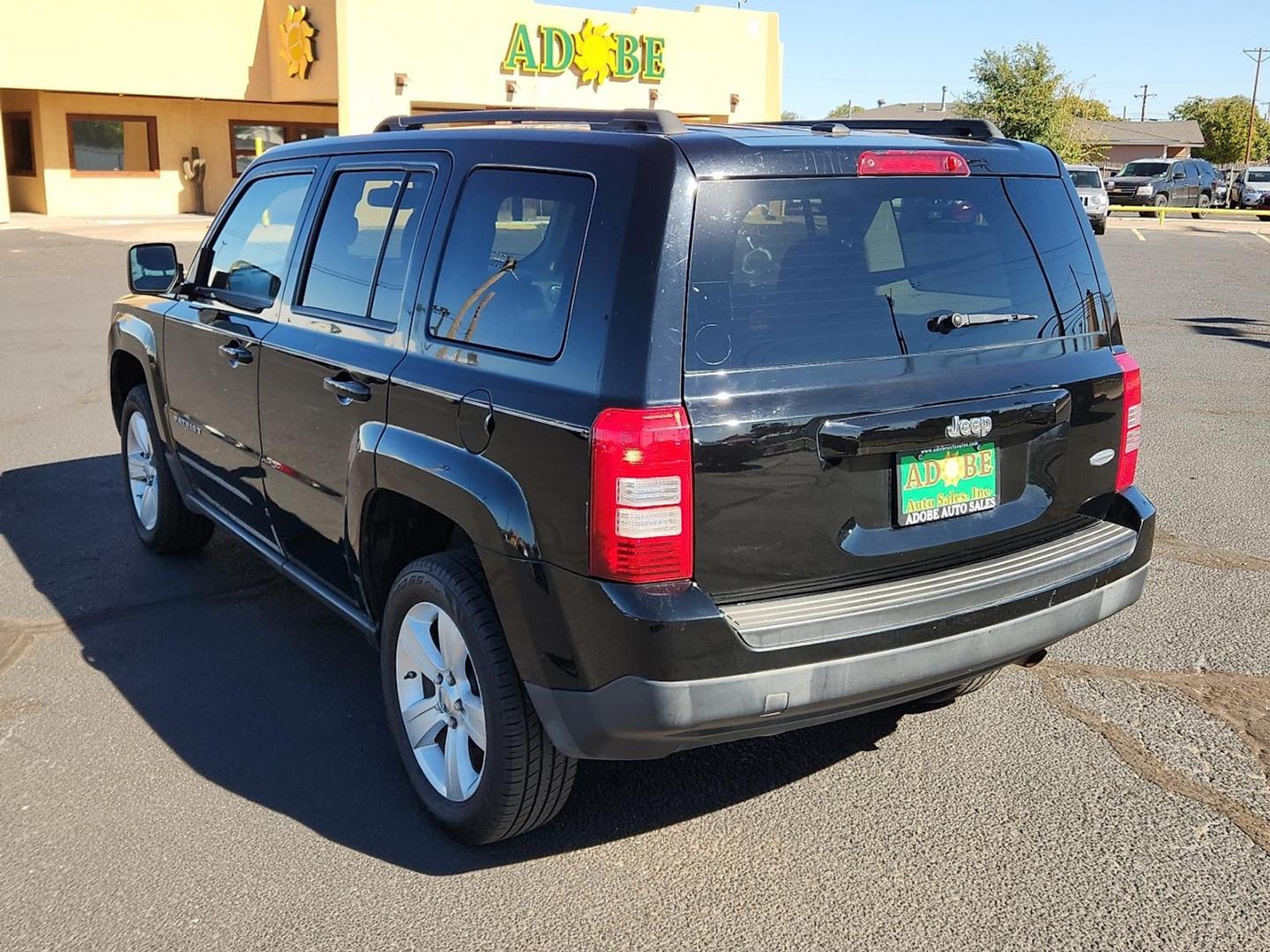 2012 BLACK Jeep Patriot Latitude (1C4NJPFB6CD) with an 2.4L I-4 DOHC, variable valve control, regular unleaded, engine with 172HP engine, located at 4711 Ave Q, Lubbock, TX, 79412, (806) 687-2362, 33.551304, -101.855293 - Photo#2
