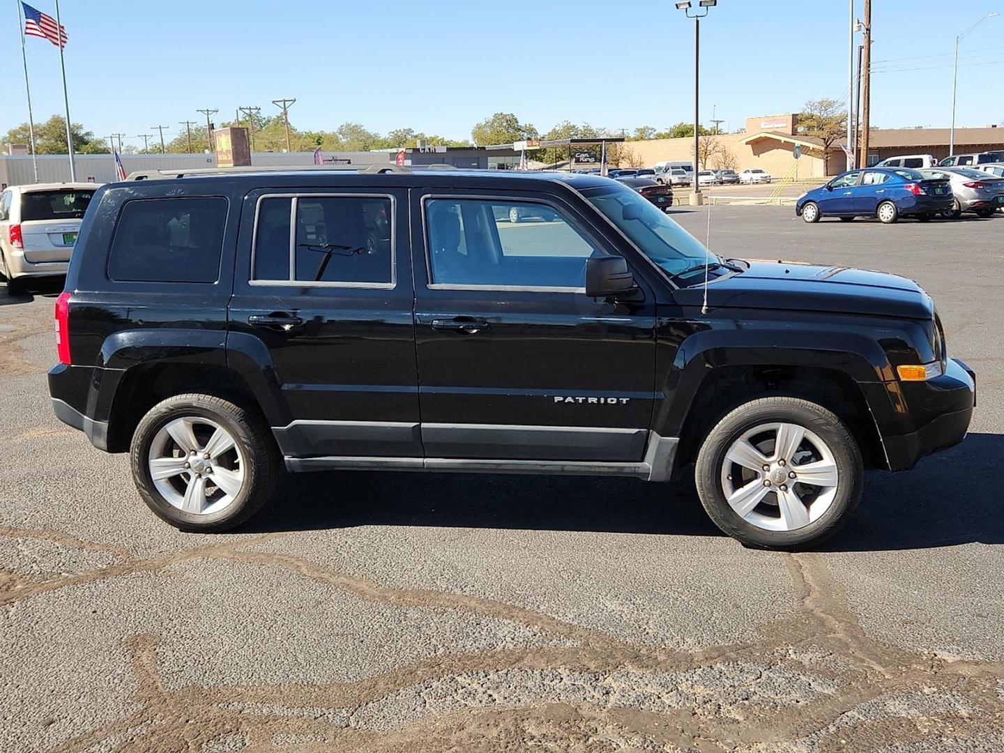 2012 BLACK Jeep Patriot Latitude (1C4NJPFB6CD) with an 2.4L I-4 DOHC, variable valve control, regular unleaded, engine with 172HP engine, located at 4711 Ave Q, Lubbock, TX, 79412, (806) 687-2362, 33.551304, -101.855293 - Photo#4