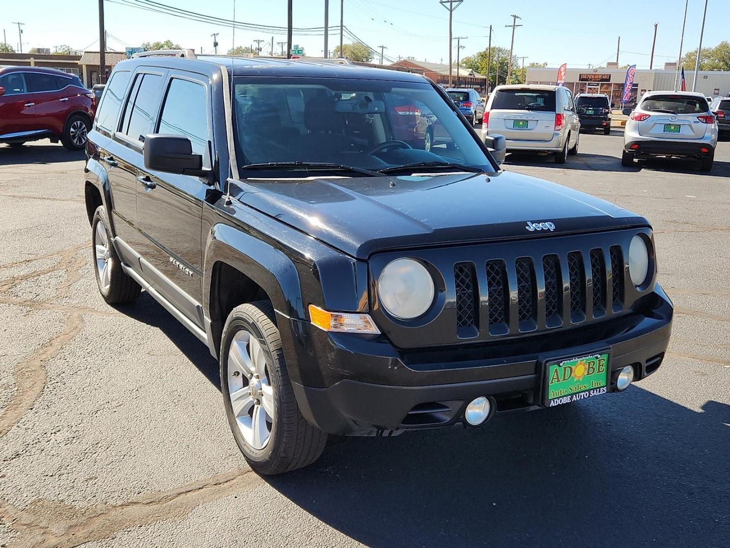 2012 BLACK Jeep Patriot Latitude (1C4NJPFB6CD) with an 2.4L I-4 DOHC, variable valve control, regular unleaded, engine with 172HP engine, located at 4711 Ave Q, Lubbock, TX, 79412, (806) 687-2362, 33.551304, -101.855293 - Photo#5