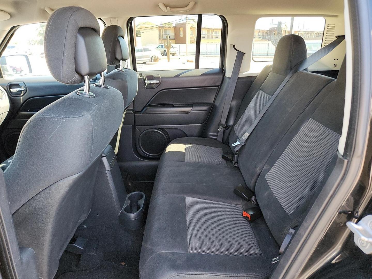 2012 BLACK Jeep Patriot Latitude (1C4NJPFB6CD) with an 2.4L I-4 DOHC, variable valve control, regular unleaded, engine with 172HP engine, located at 4711 Ave Q, Lubbock, TX, 79412, (806) 687-2362, 33.551304, -101.855293 - Photo#11