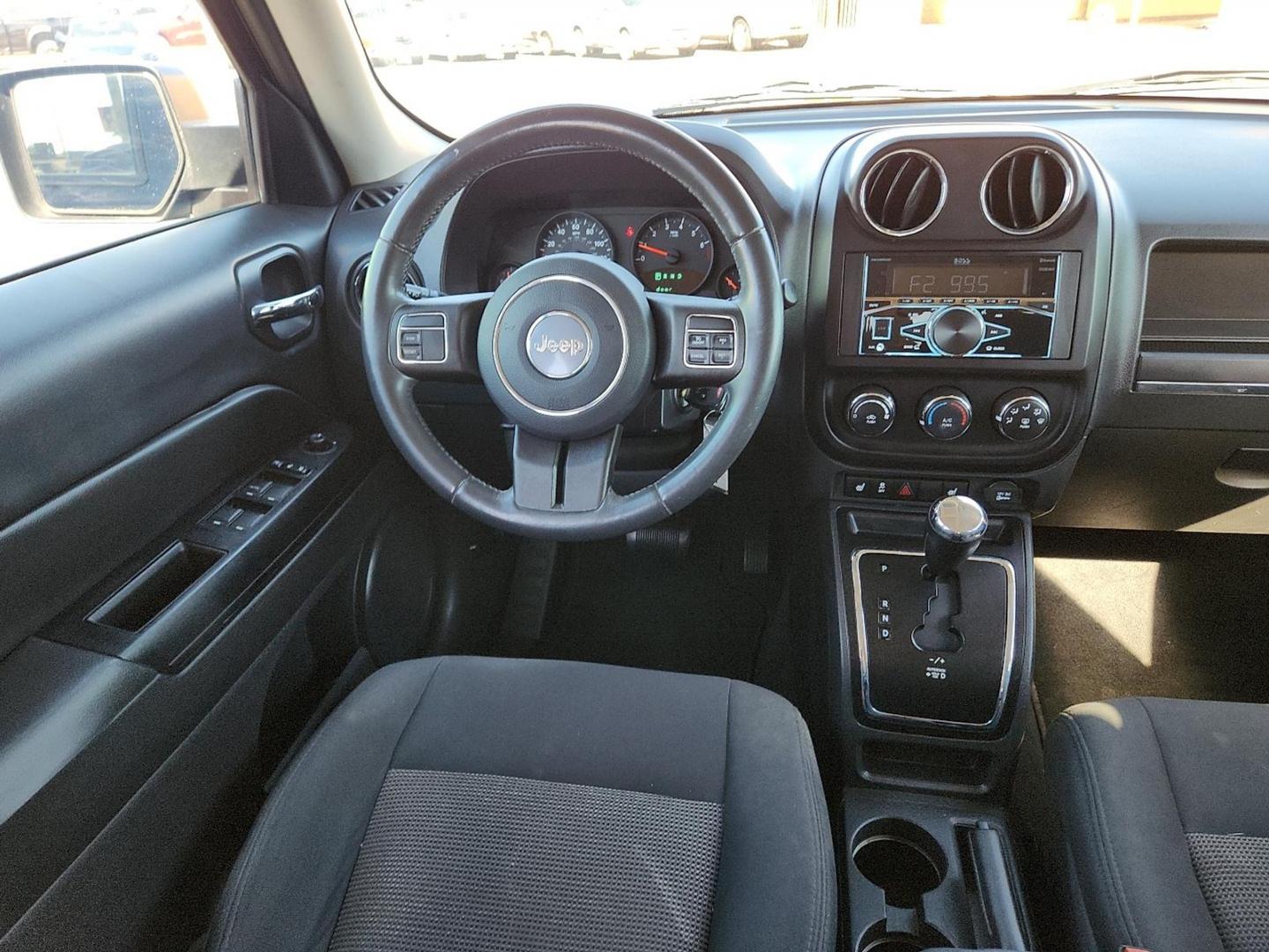 2012 BLACK Jeep Patriot Latitude (1C4NJPFB6CD) with an 2.4L I-4 DOHC, variable valve control, regular unleaded, engine with 172HP engine, located at 4711 Ave Q, Lubbock, TX, 79412, (806) 687-2362, 33.551304, -101.855293 - Photo#12