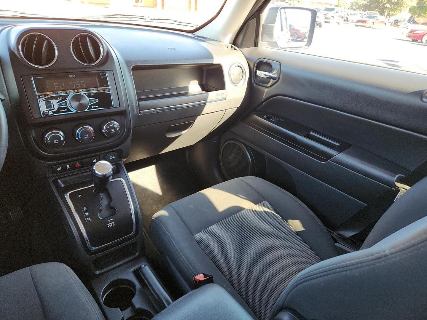2012 BLACK Jeep Patriot Latitude (1C4NJPFB6CD) with an 2.4L I-4 DOHC, variable valve control, regular unleaded, engine with 172HP engine, located at 4711 Ave Q, Lubbock, TX, 79412, (806) 687-2362, 33.551304, -101.855293 - Photo#13