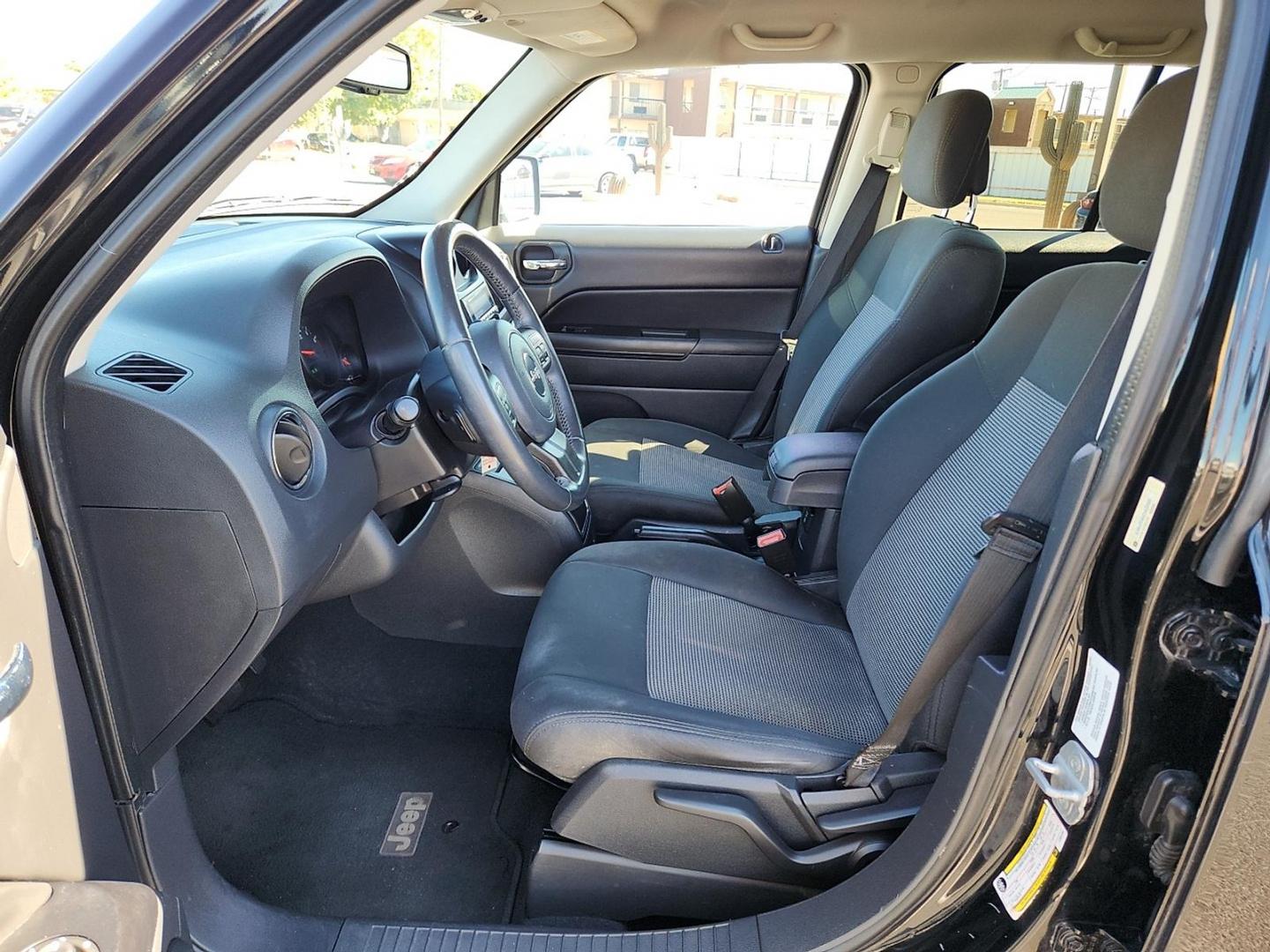 2012 BLACK Jeep Patriot Latitude (1C4NJPFB6CD) with an 2.4L I-4 DOHC, variable valve control, regular unleaded, engine with 172HP engine, located at 4711 Ave Q, Lubbock, TX, 79412, (806) 687-2362, 33.551304, -101.855293 - Photo#14