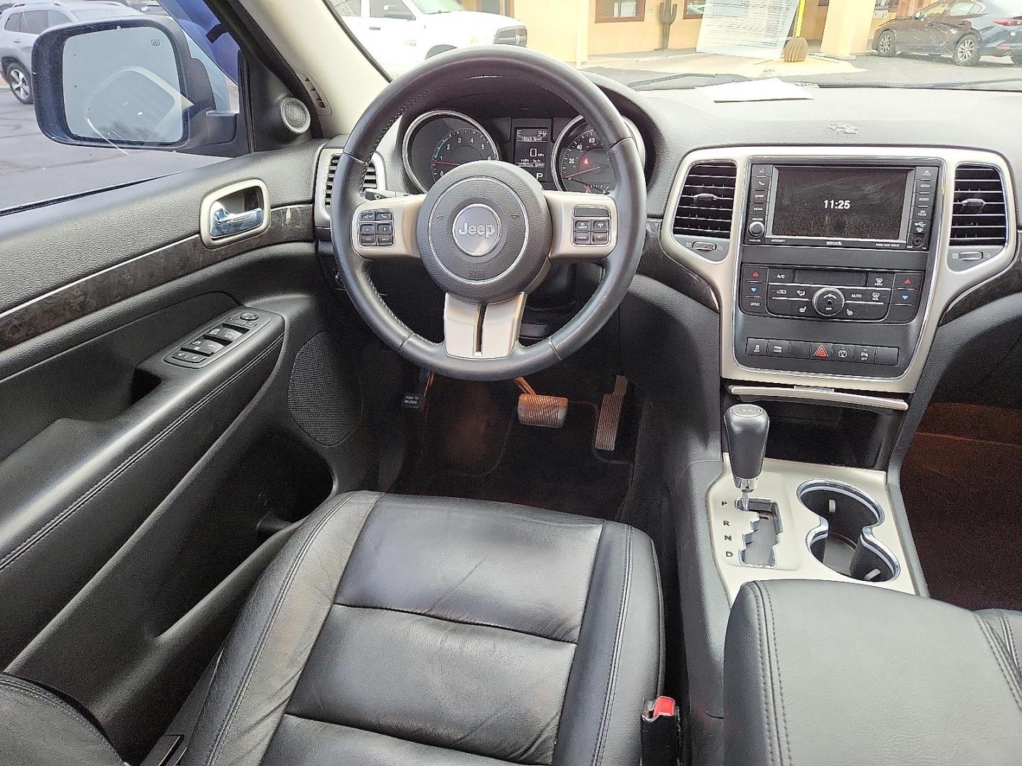 2013 BLUE Jeep Grand Cherokee Laredo (1C4RJFAT7DC) with an HEMI 5.7L V-8 variable valve control, regular unleaded, engine with cylinder deactivation and 360HP engine, located at 4711 Ave Q, Lubbock, TX, 79412, (806) 687-2362, 33.551304, -101.855293 - Photo#12